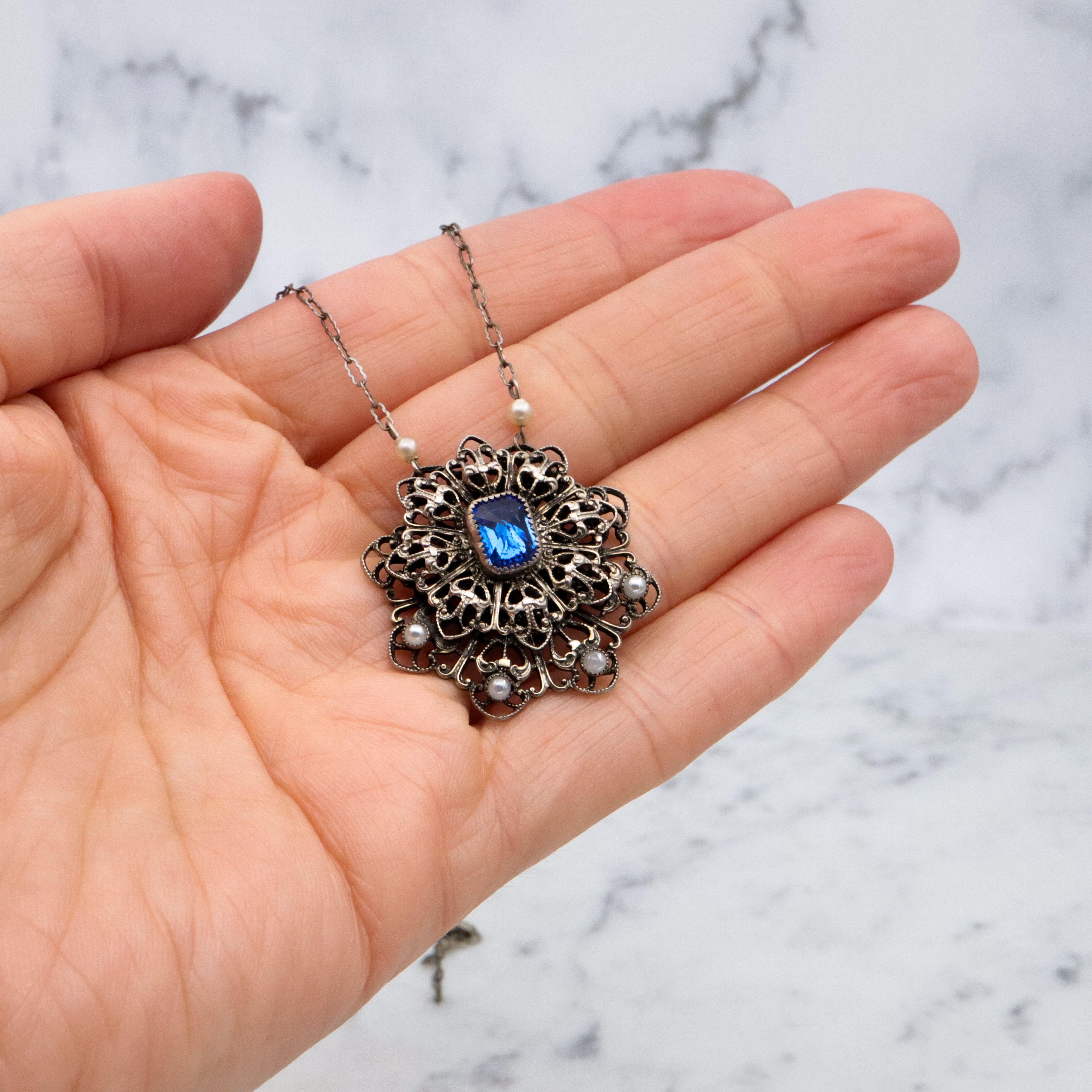 1950s silver tone filigree sapphire crystal & faux pearl flower pendant necklace