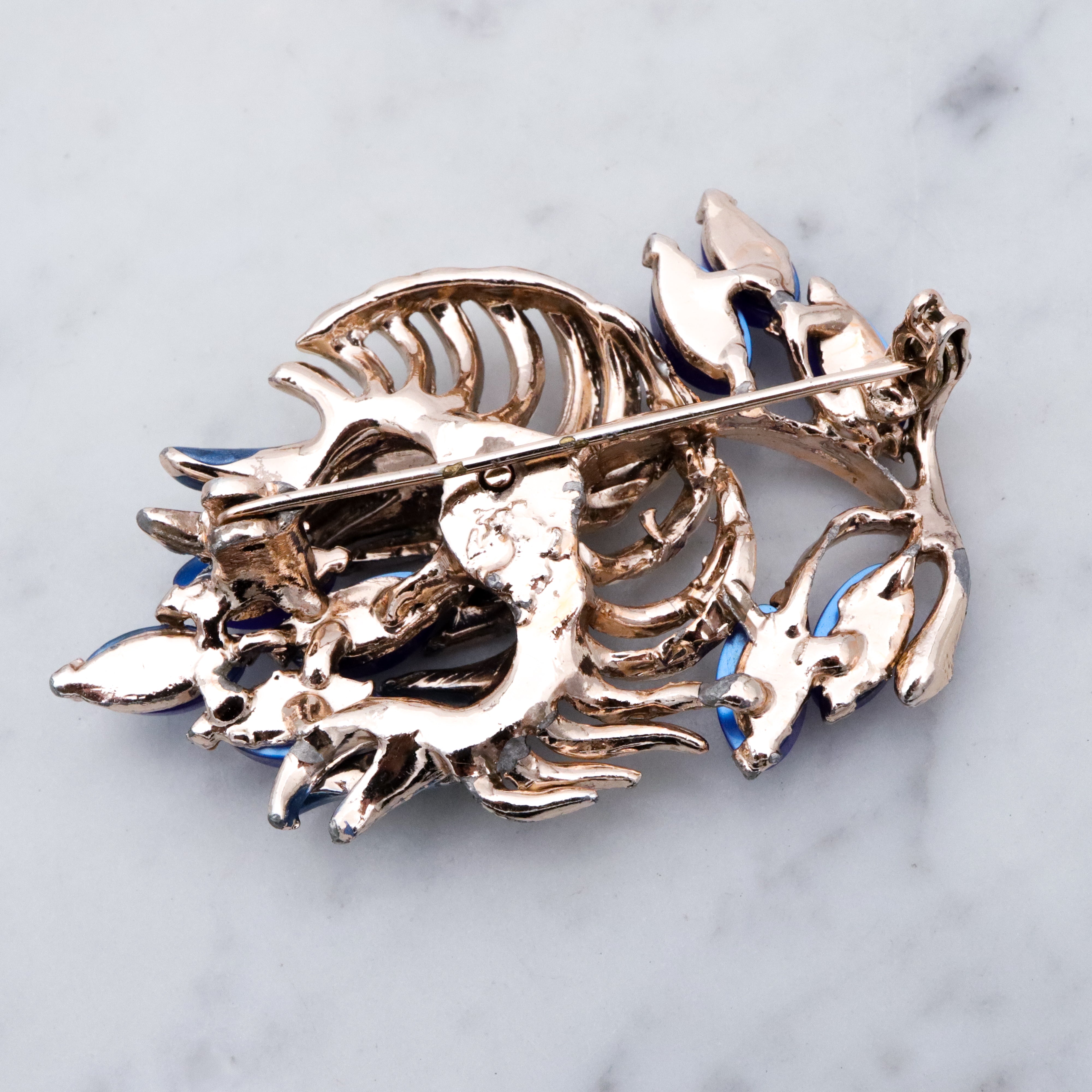 Vintage blue thermoset painted flower brooch