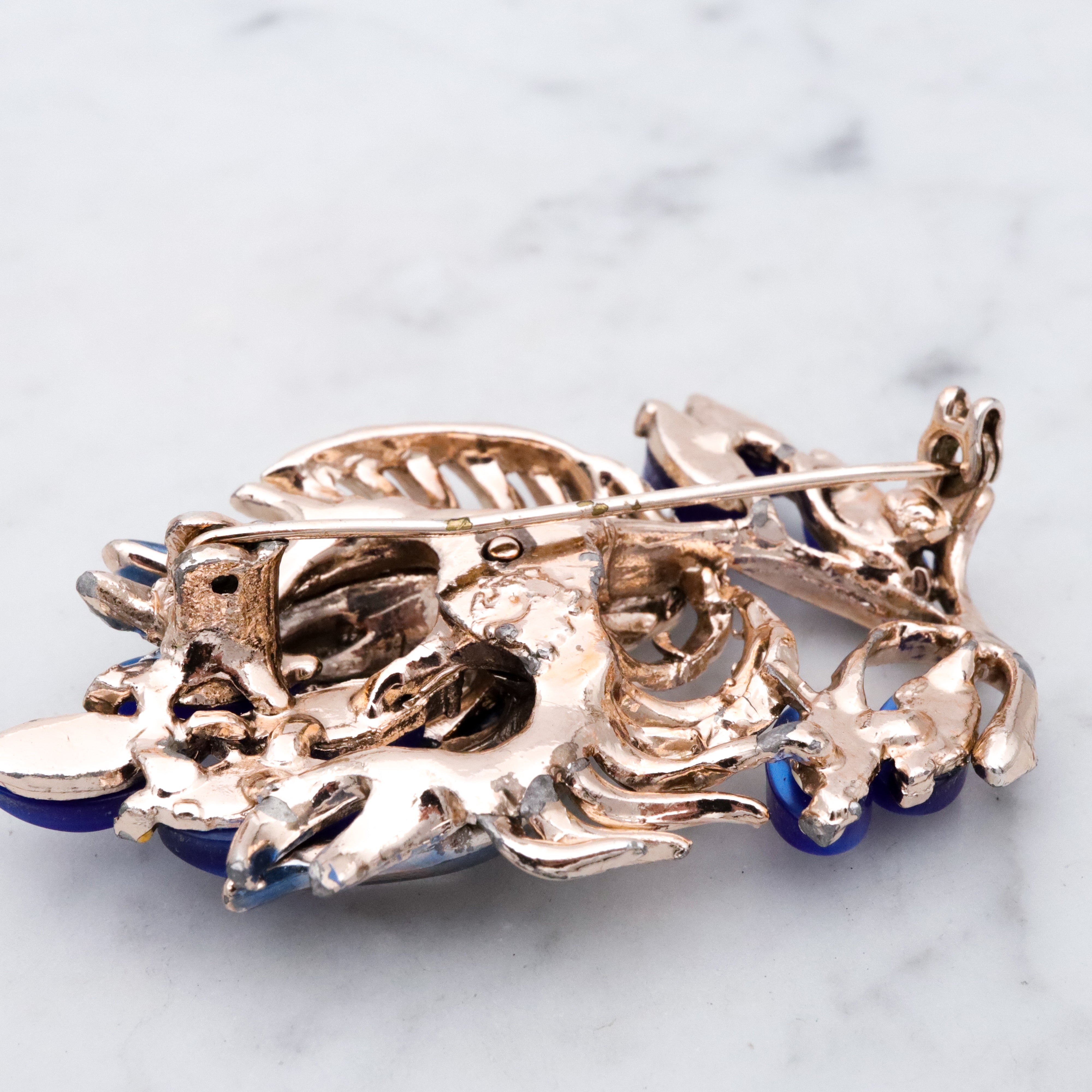 Vintage blue thermoset painted flower brooch