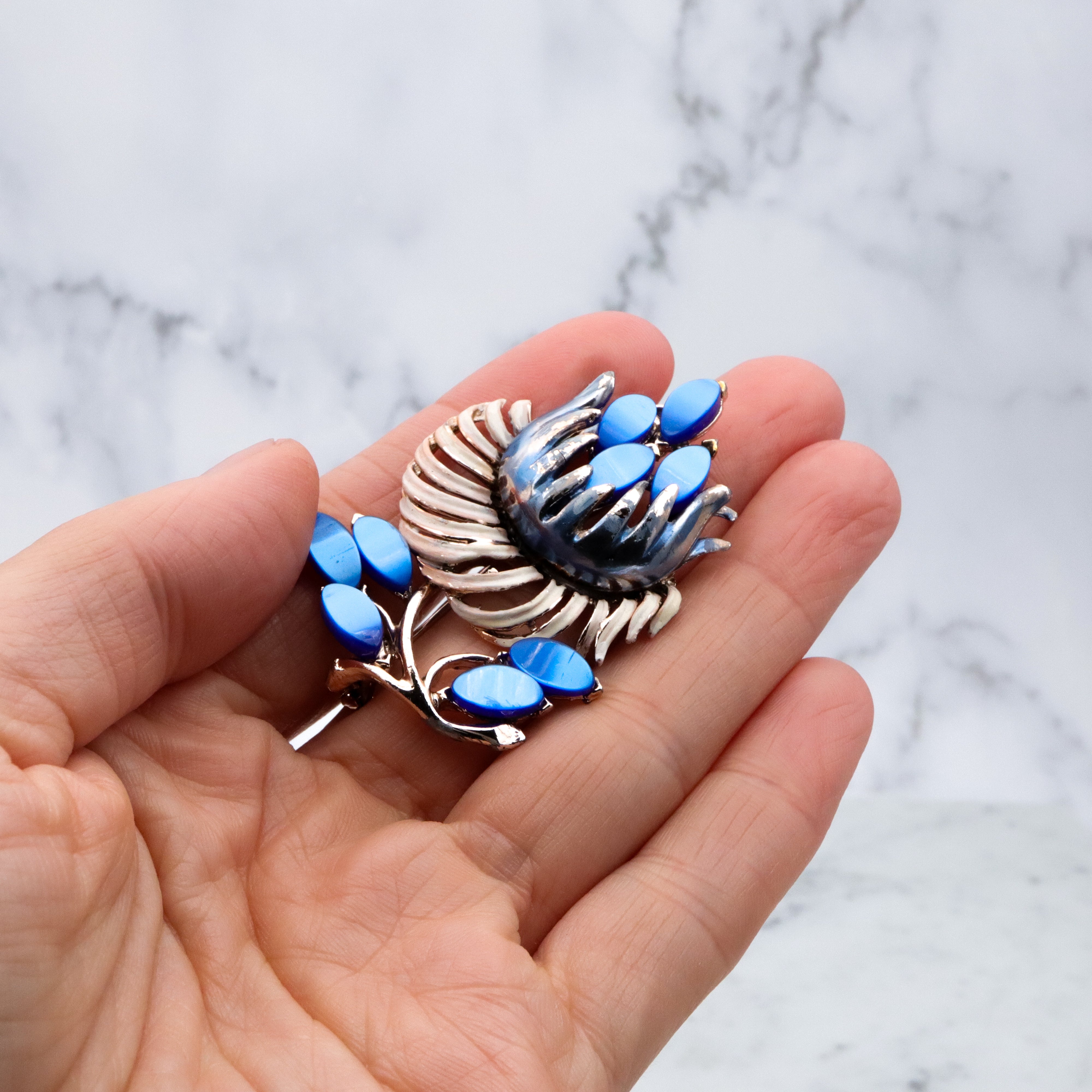 Vintage blue thermoset painted flower brooch