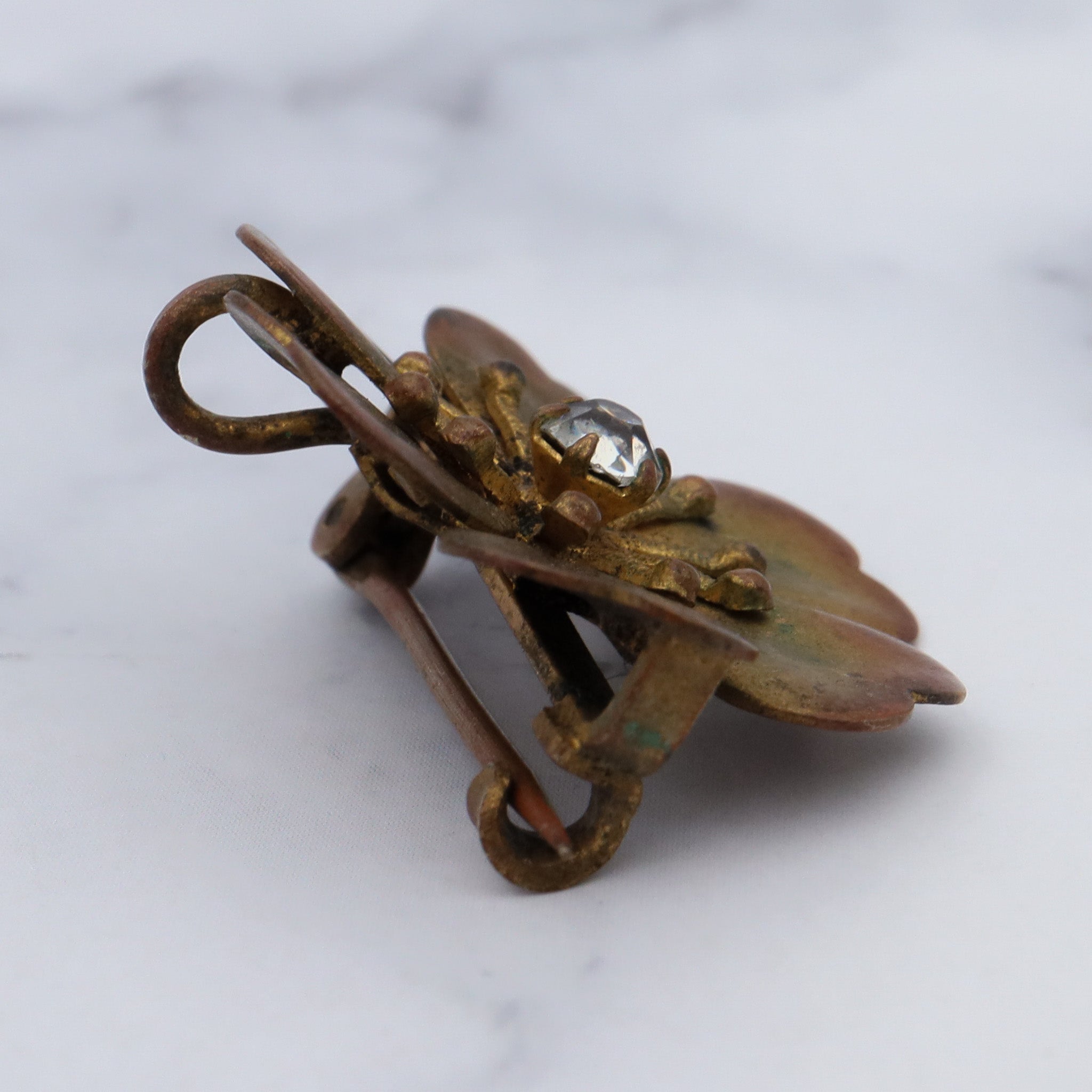 Antique Victorian painted brass & rhinestone flower brooch with pendant loop