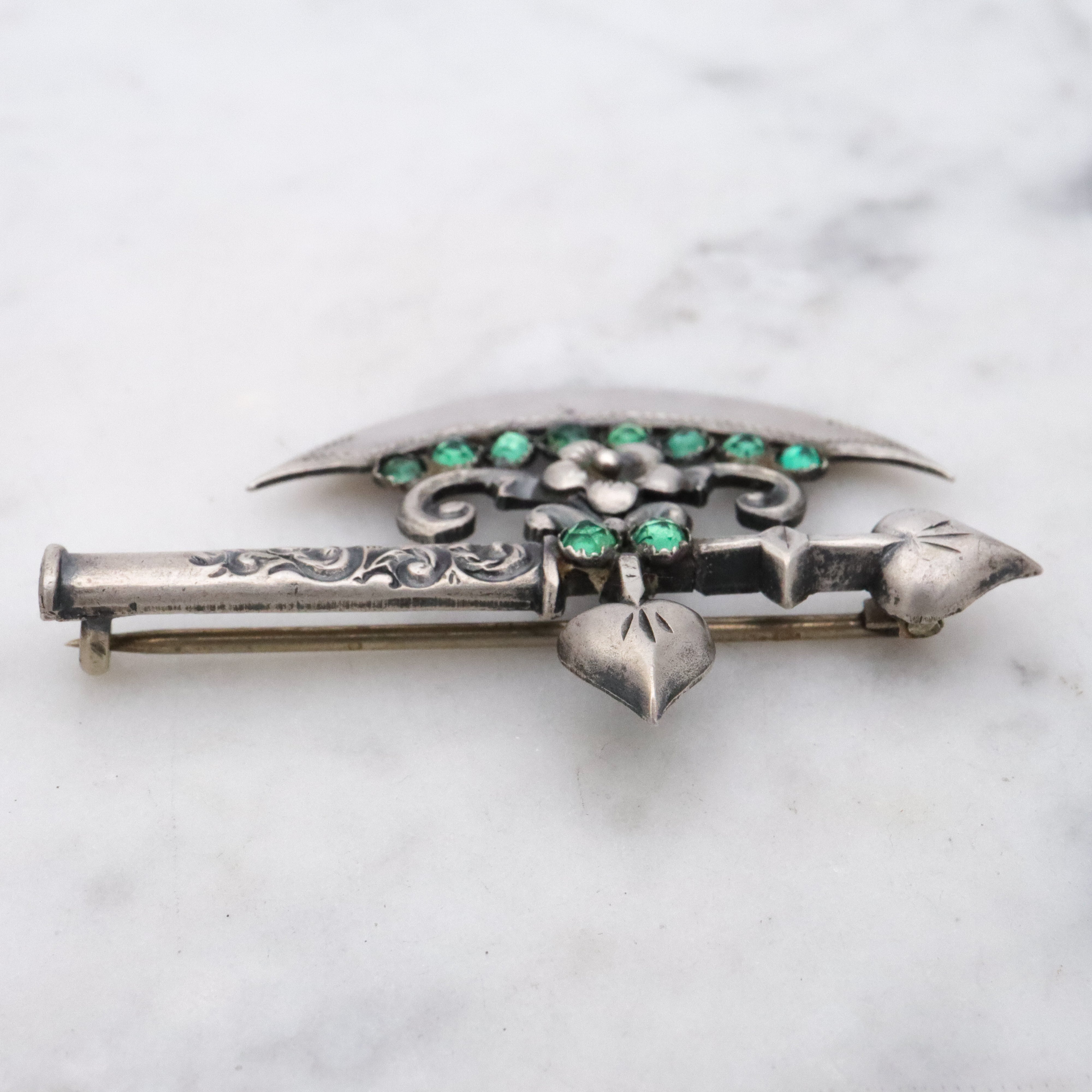 Rare Antique Victorian sterling fancy battle axe brooch with emerald paste gems