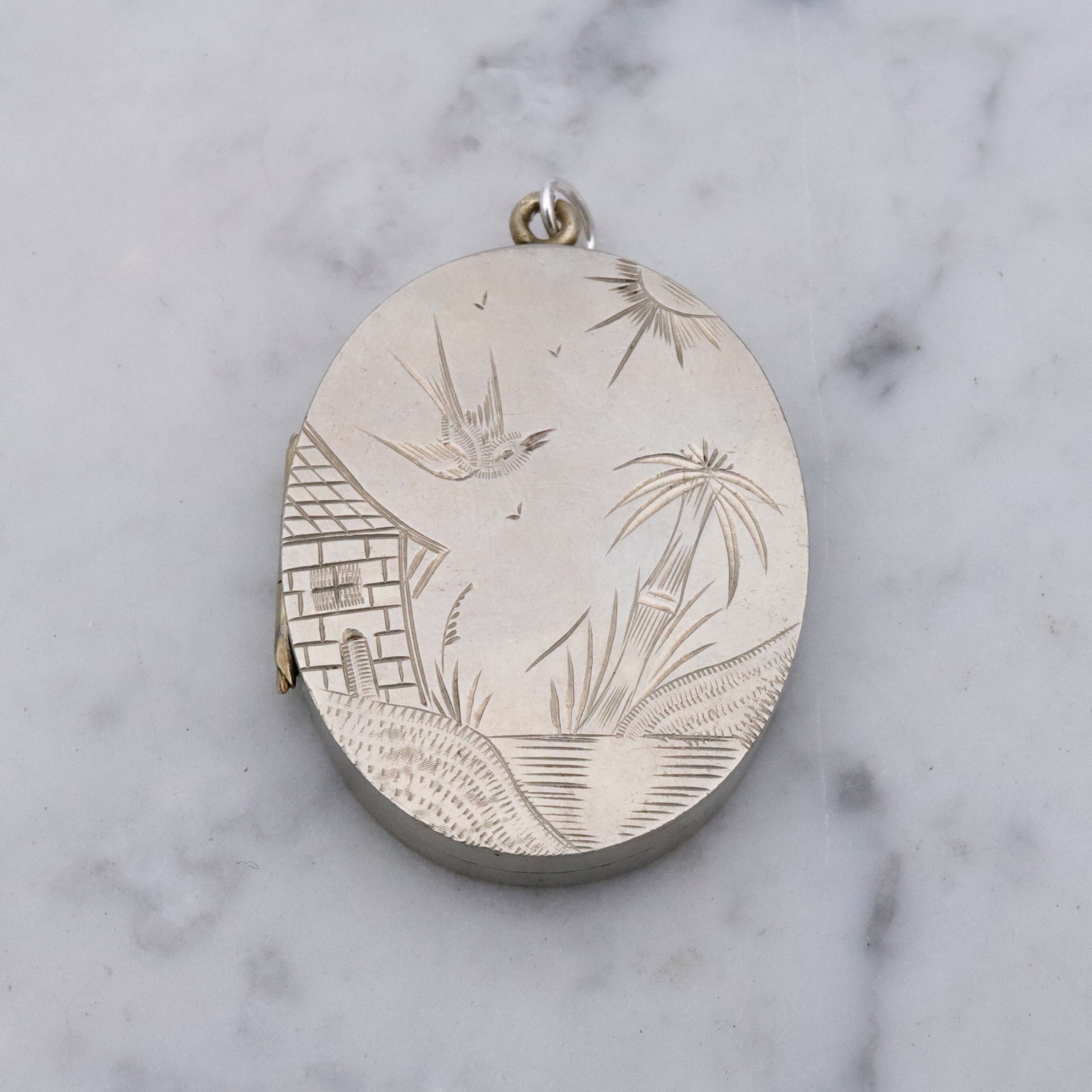 Victorian silver plated Aesthetic engraved swallow locket