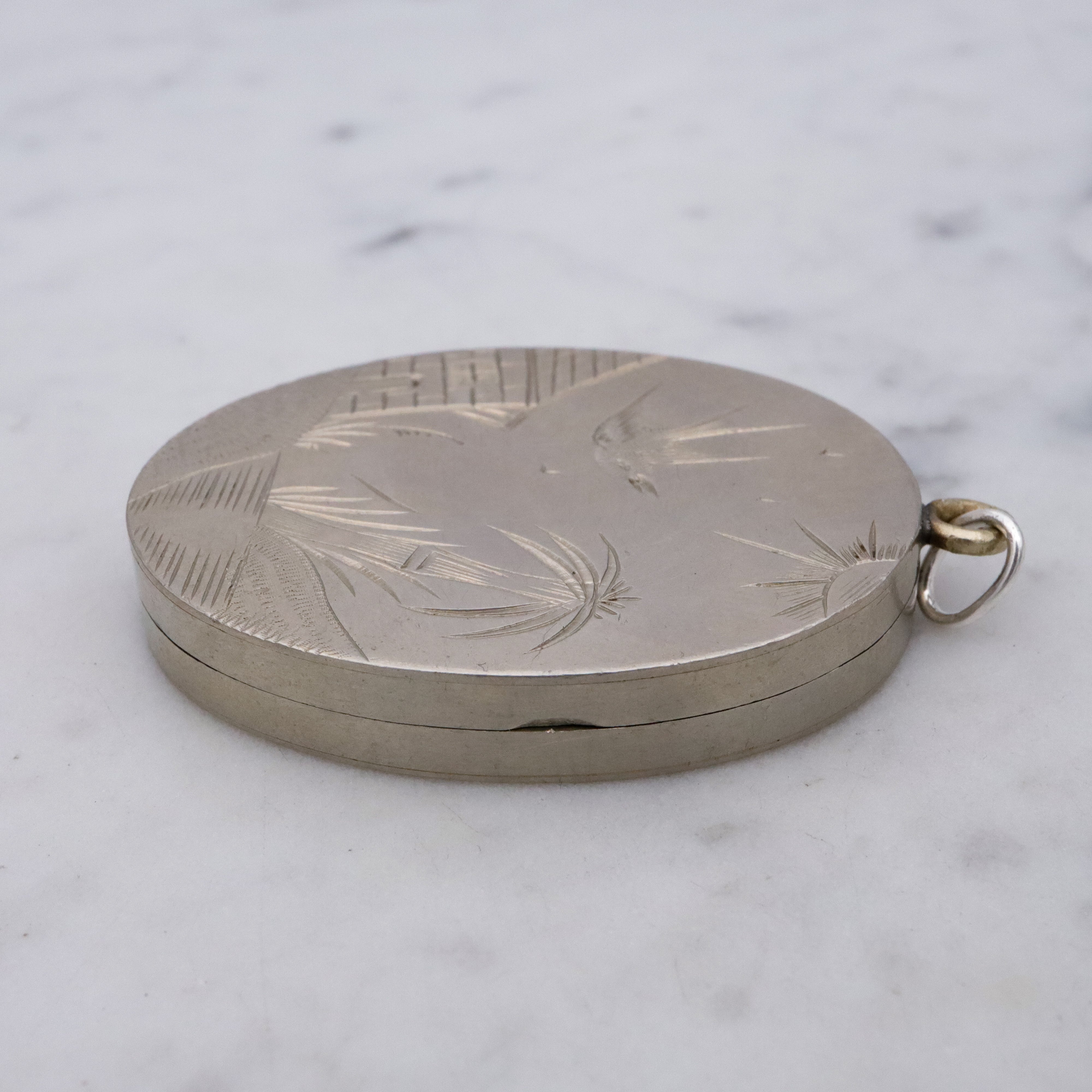 Victorian silver plated Aesthetic engraved swallow locket