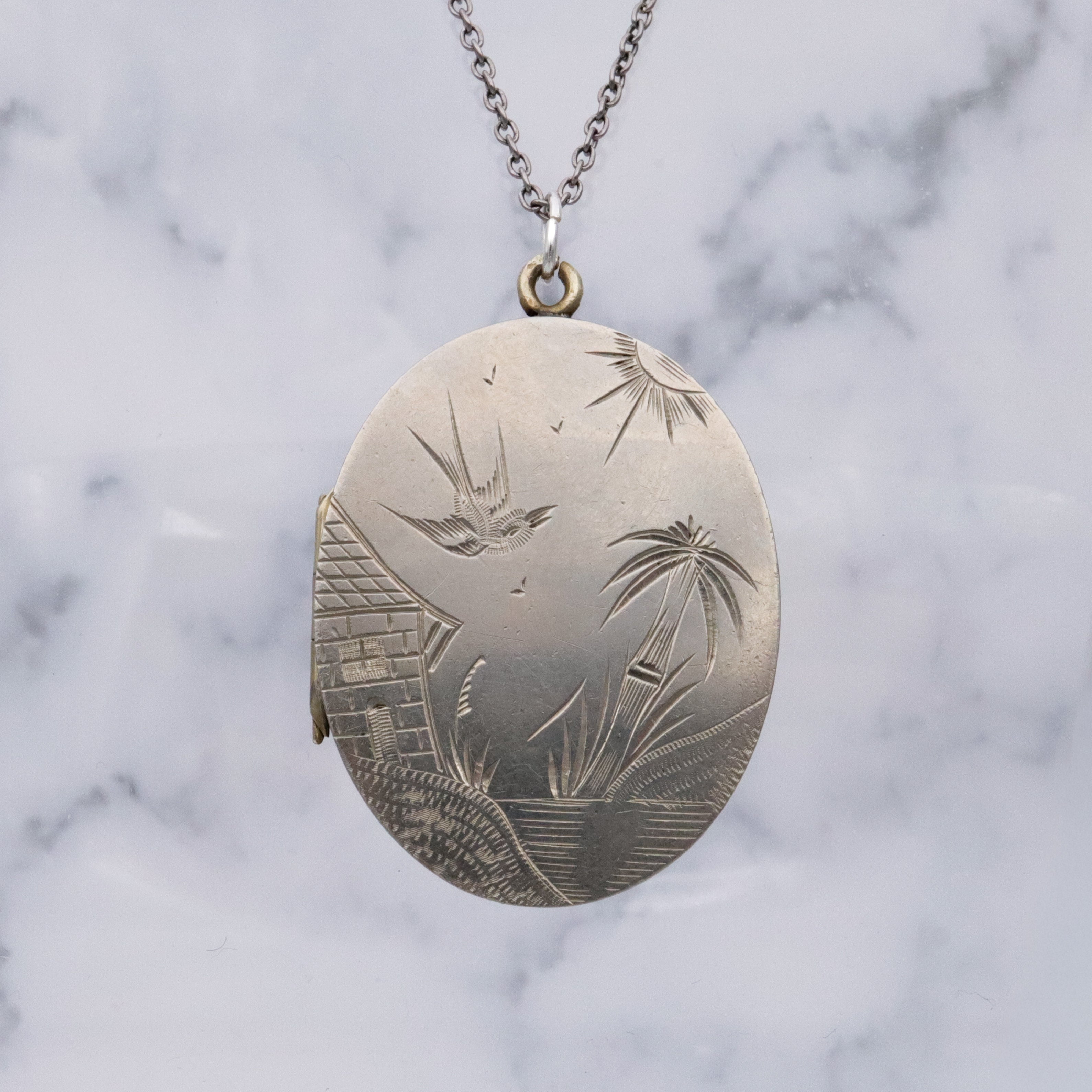 Victorian silver plated Aesthetic engraved swallow locket