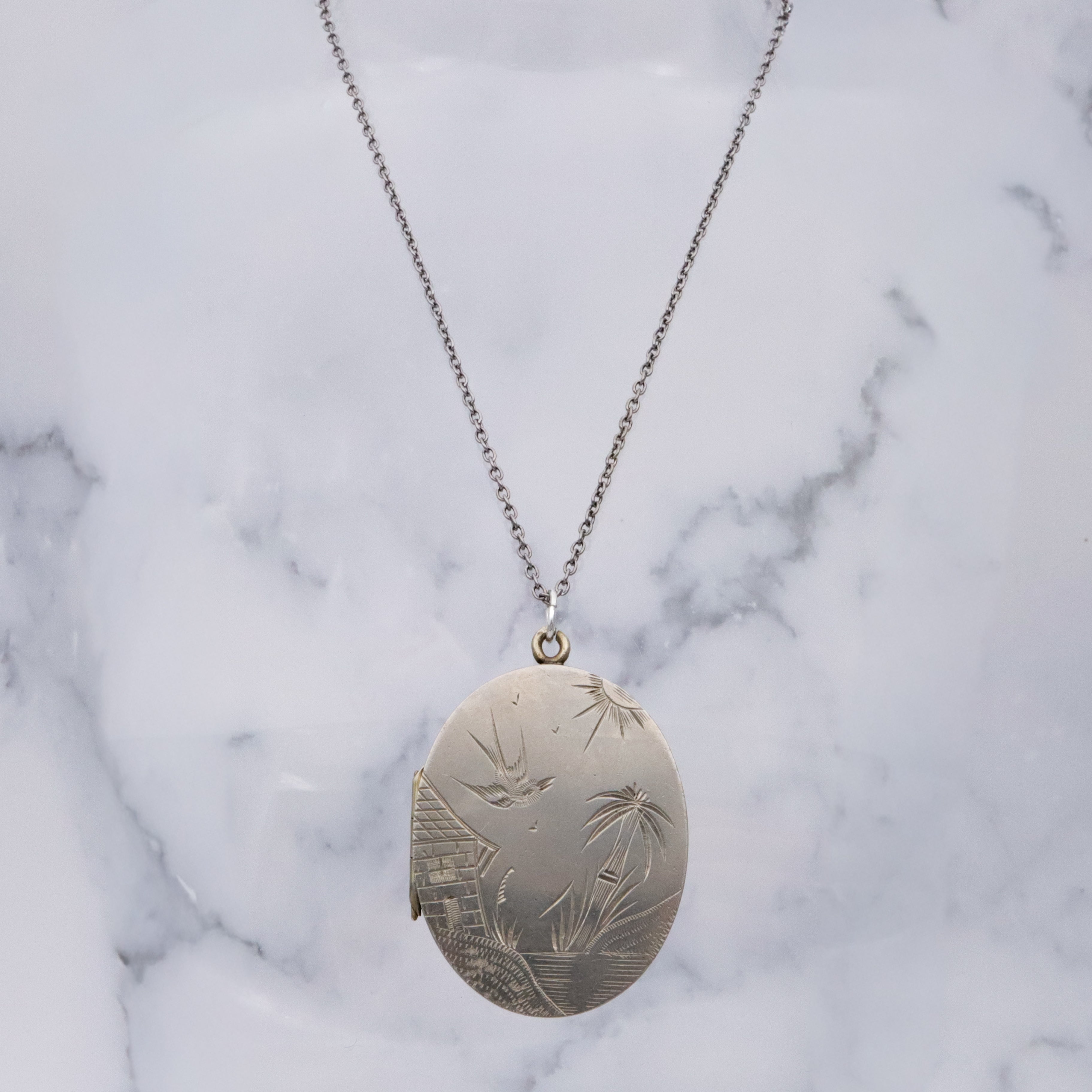 Victorian silver plated Aesthetic engraved swallow locket
