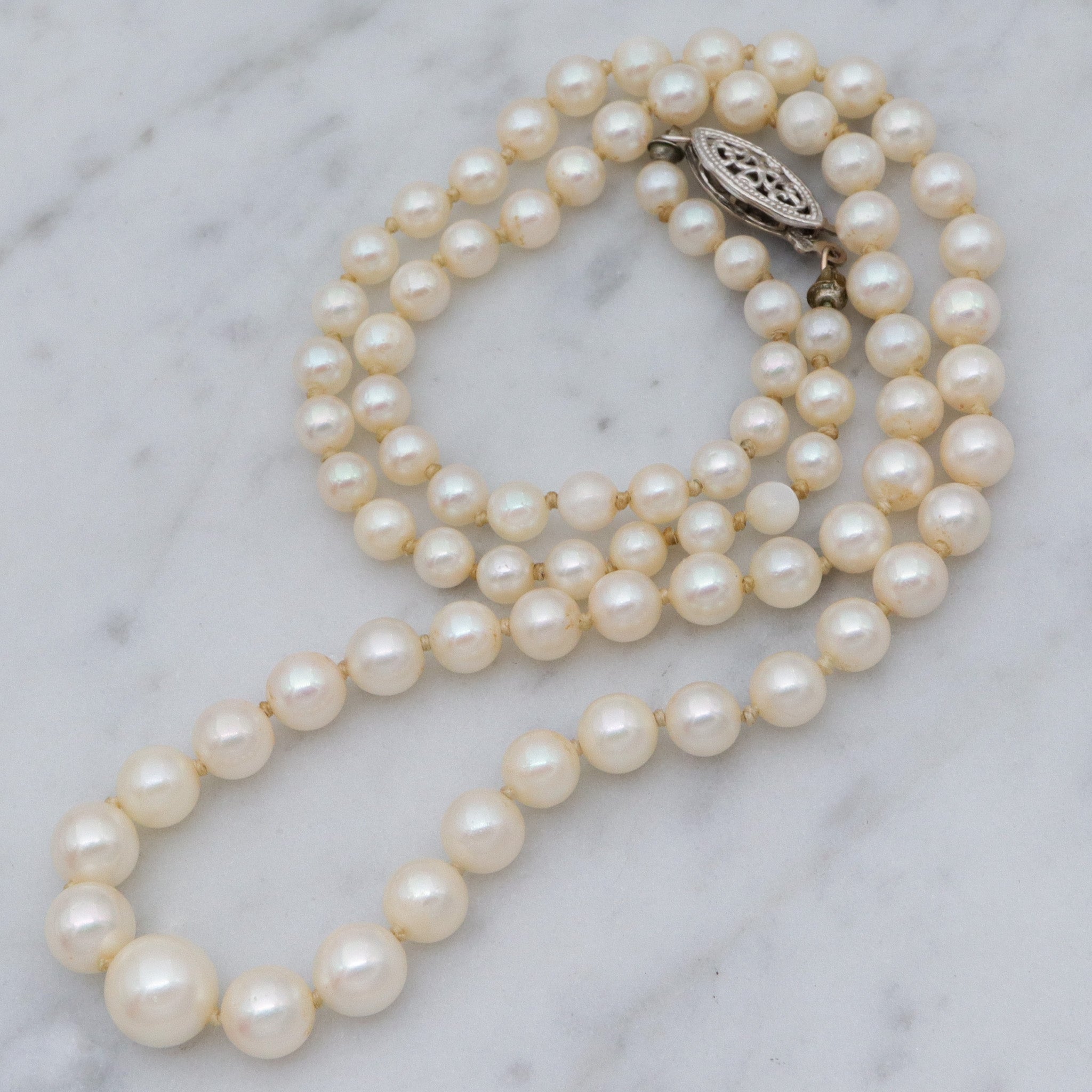 Antique Art Deco graduated pearl necklace w/ 14k white gold filigree clasp, 17"