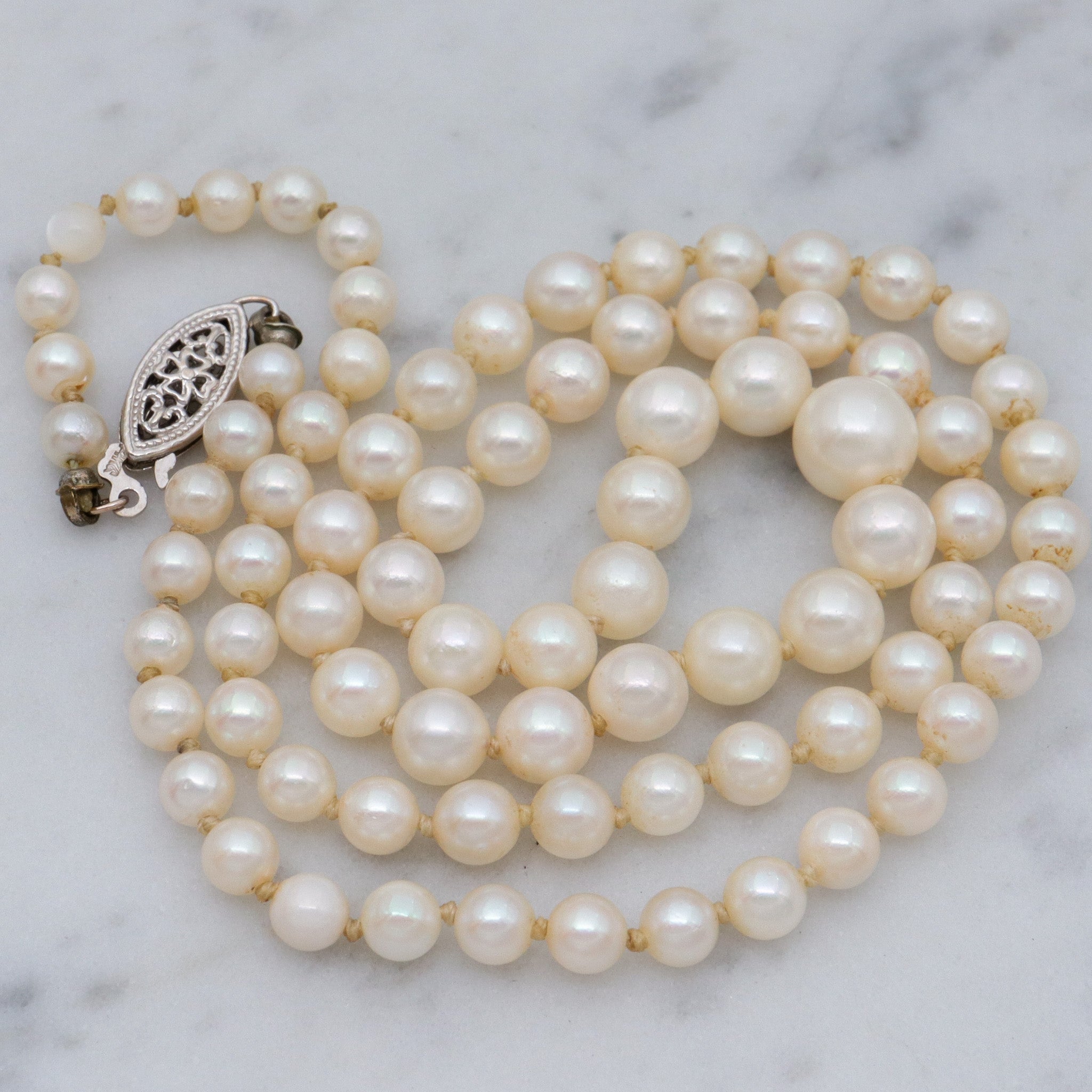 Antique Art Deco graduated pearl necklace w/ 14k white gold filigree clasp, 17"