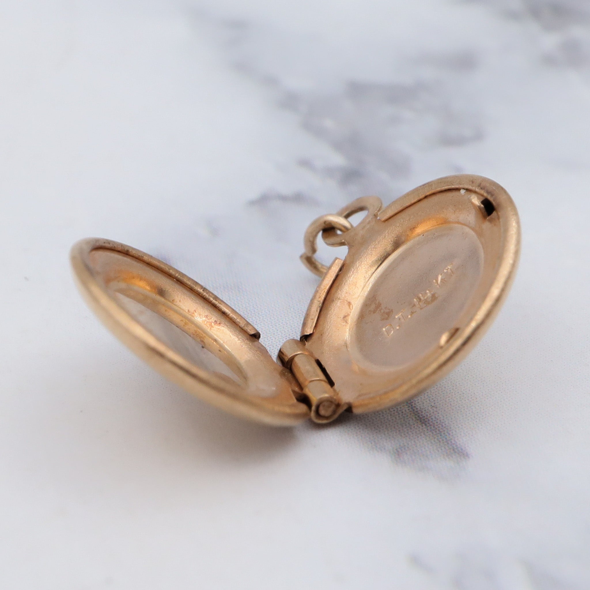 Tiny vintage 14k gold round locket