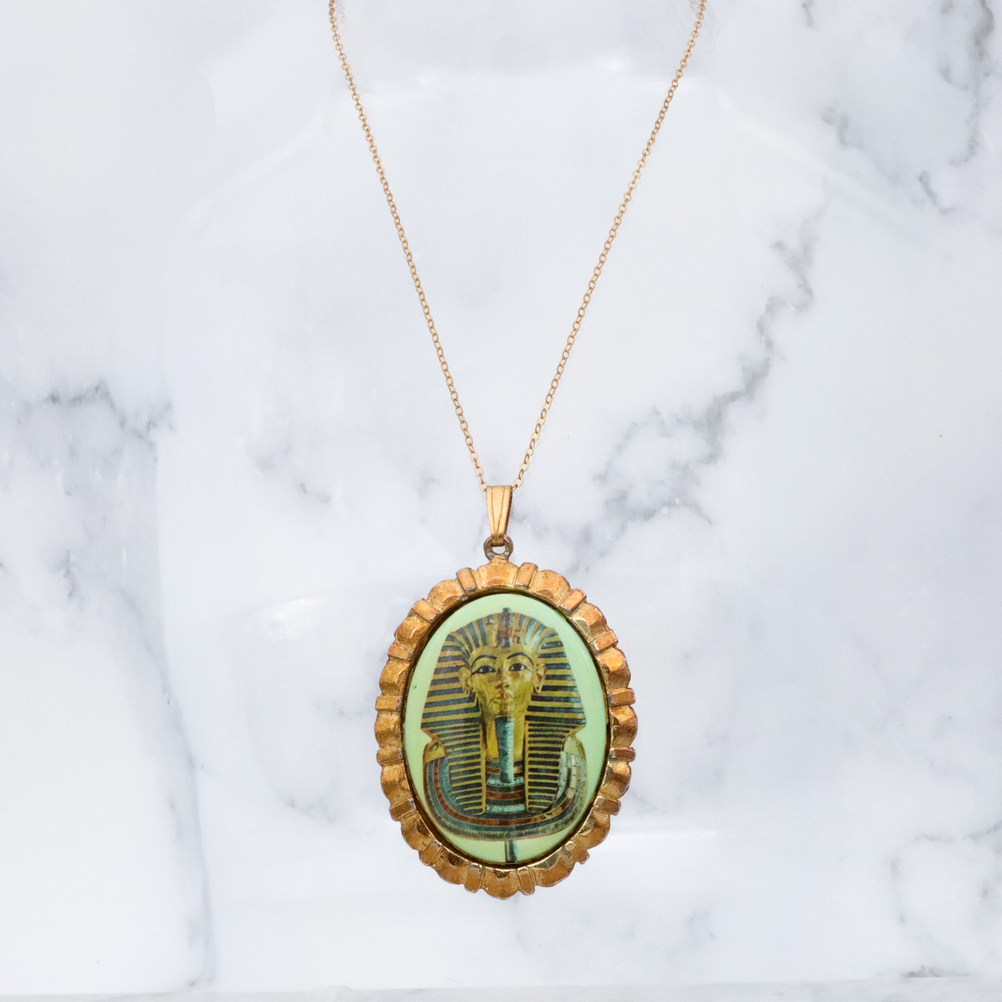 Mid Century gold tone & green glass Egyptian Revival plaque pendant