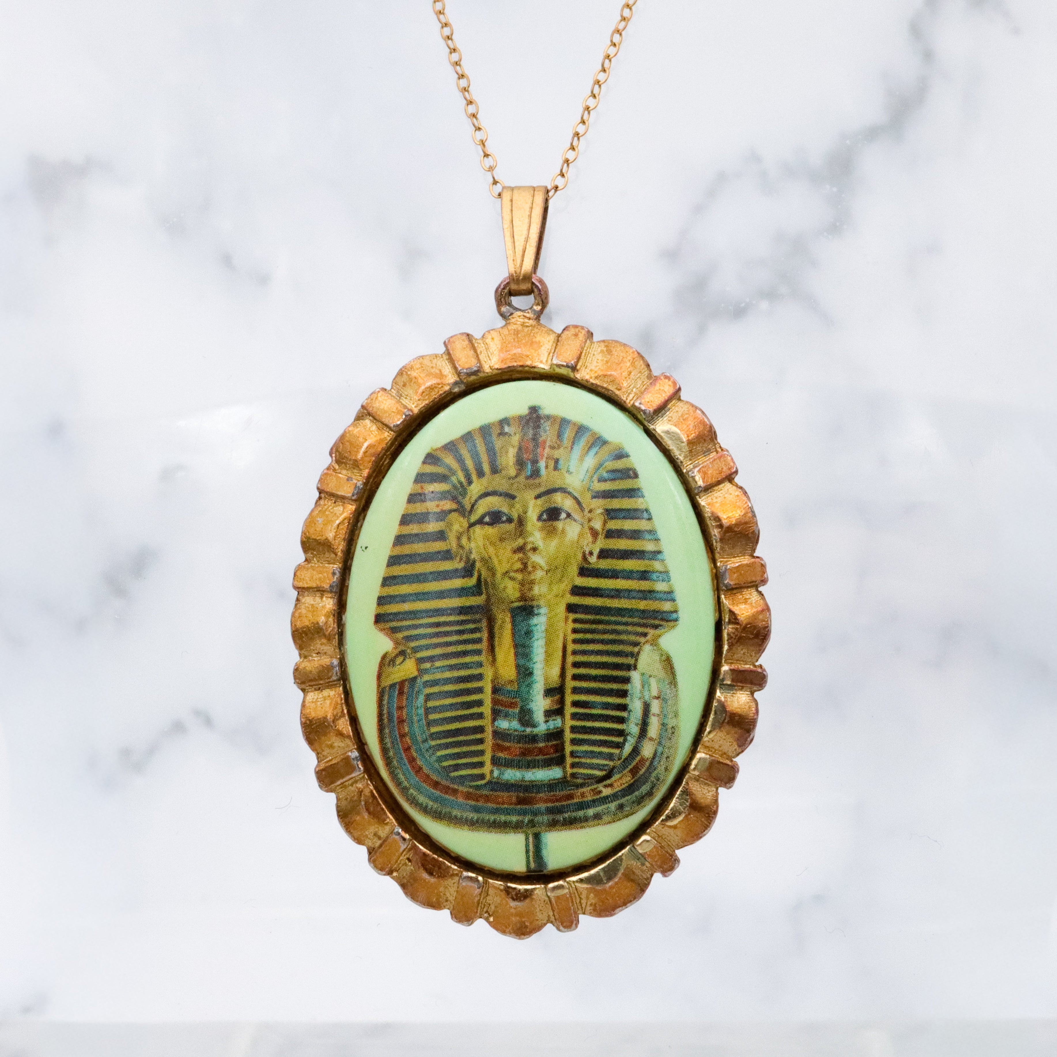 Mid Century gold tone & green glass Egyptian Revival plaque pendant