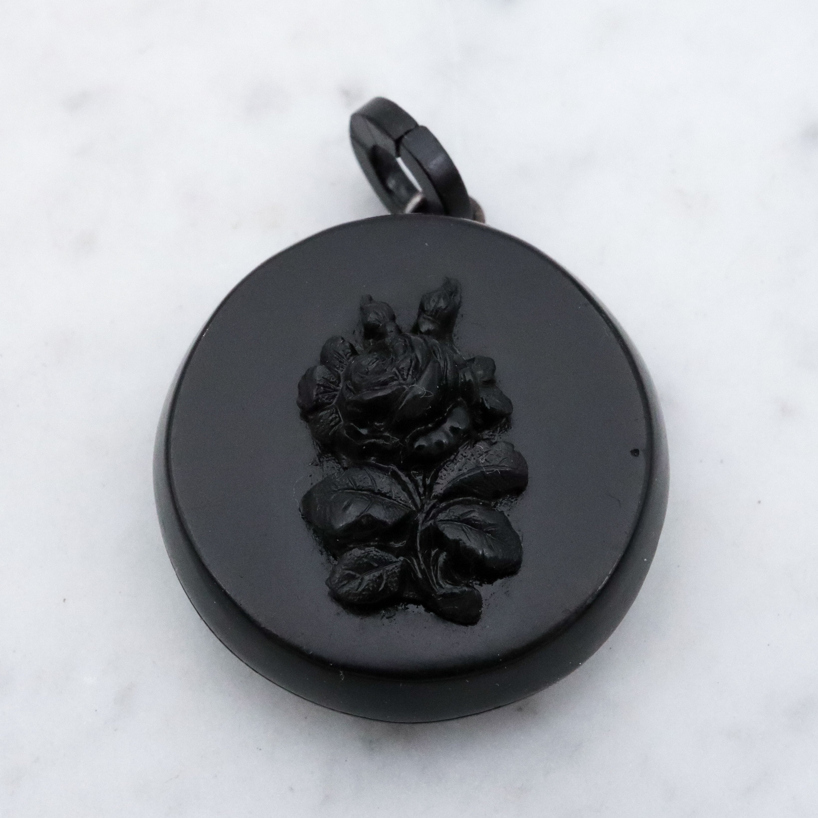 Victorian gutta percha flower round small mourning locket