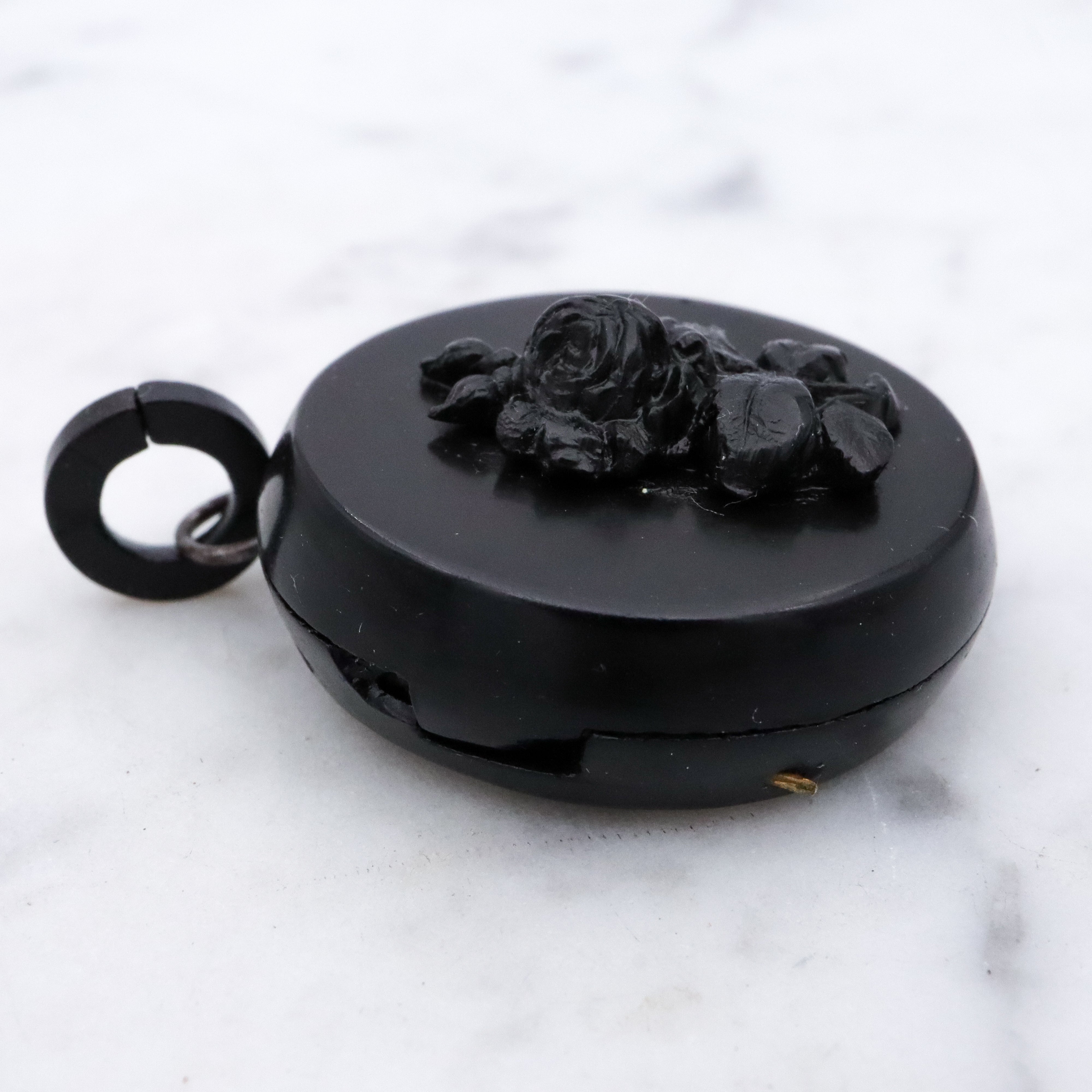 Victorian gutta percha flower round small mourning locket