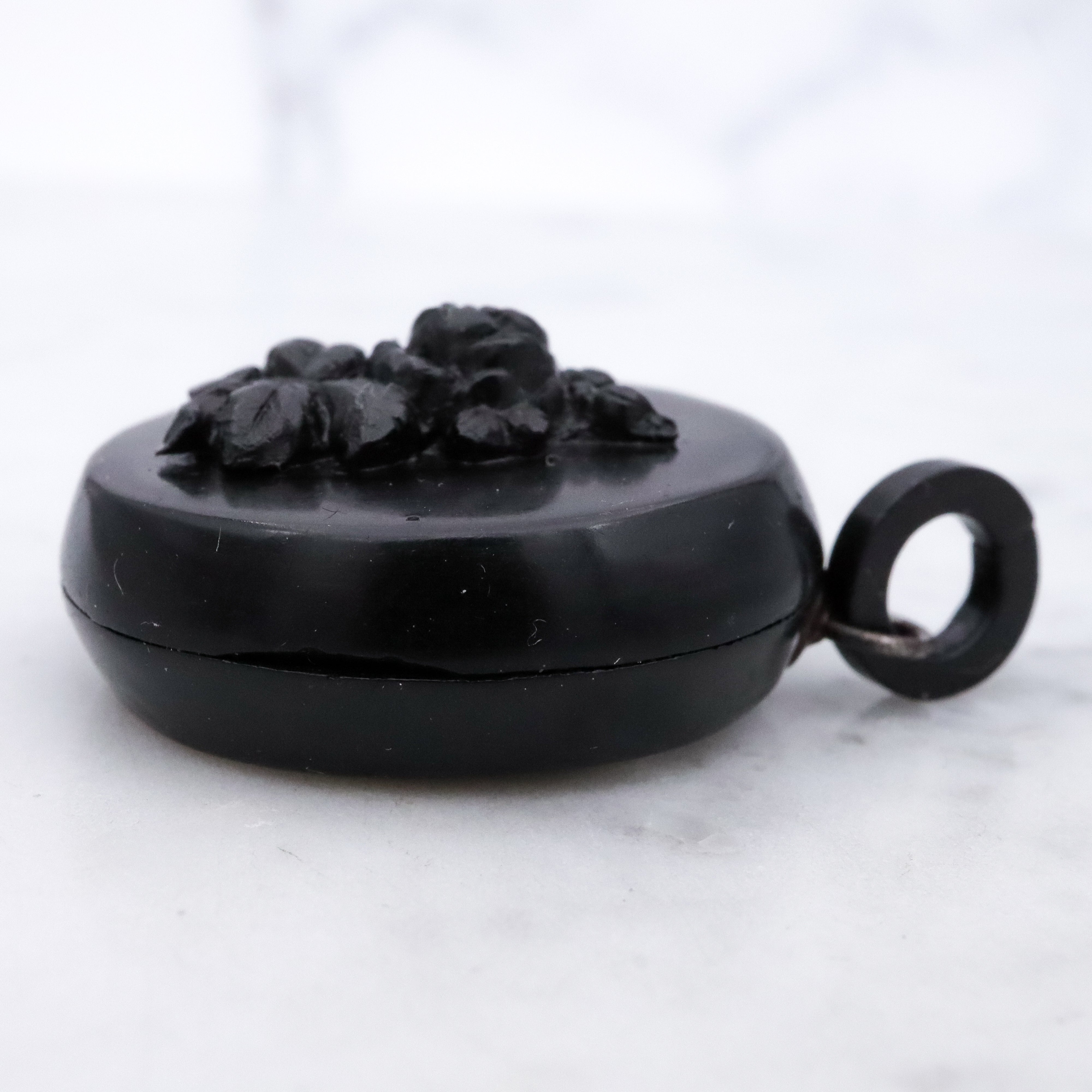 Victorian gutta percha flower round small mourning locket