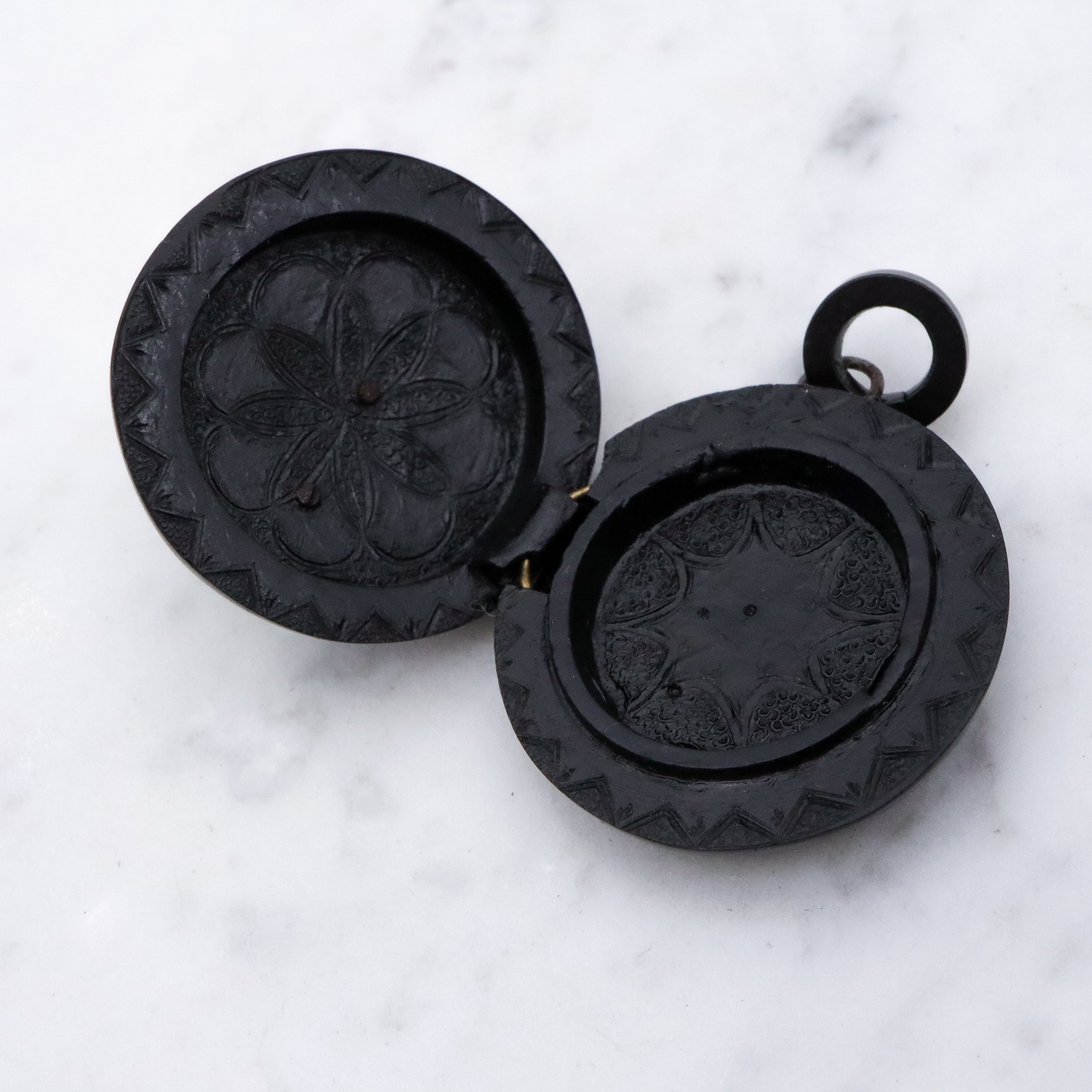 Victorian gutta percha flower round small mourning locket