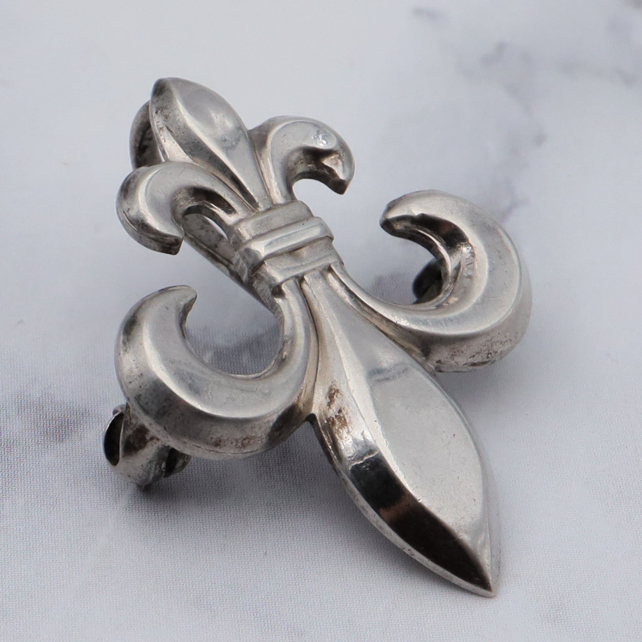 Antique W.E. Richards “WRE” symmetalic sterling fleur de lis pin with fob clip