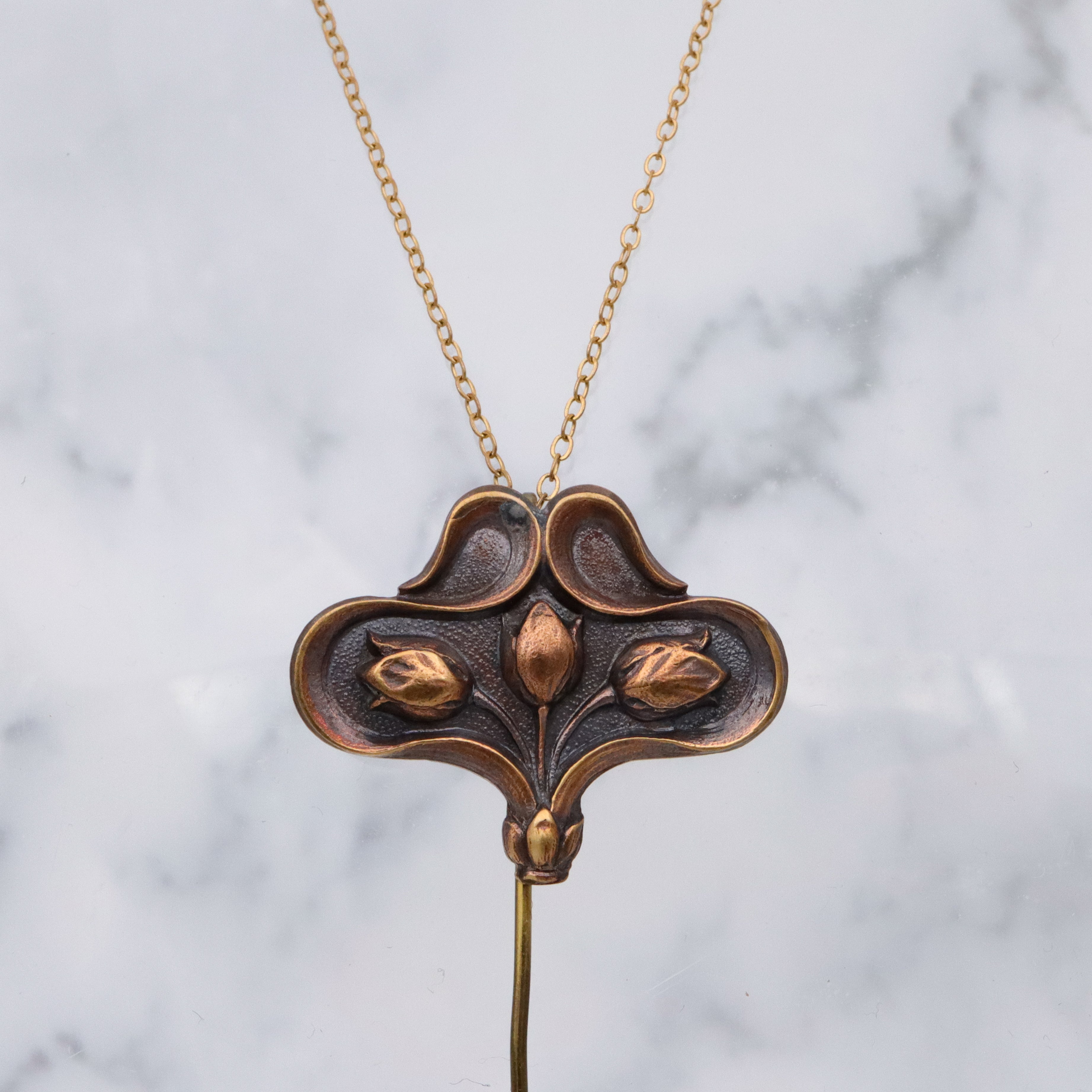 Art Nouveau copper floral stick pin brooch