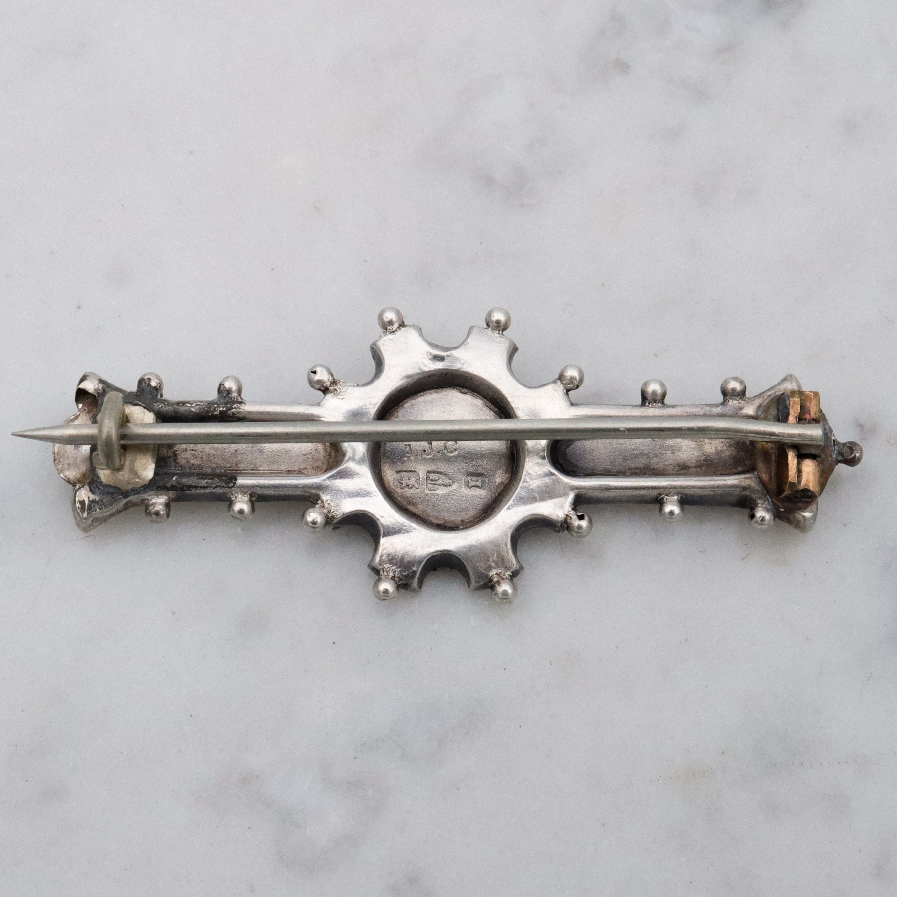 Victorian tri-color sterling Aesthetic Movement bar brooch with dimensional flower basket