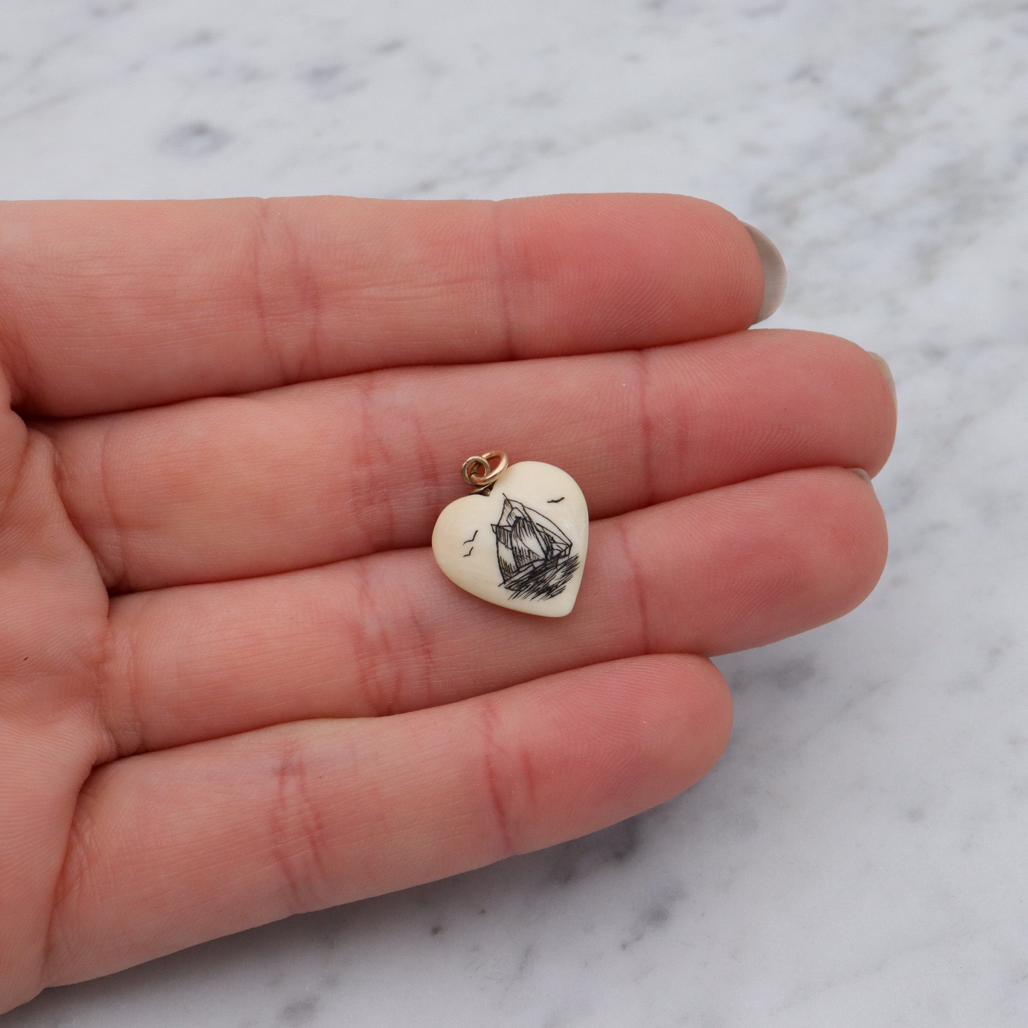 Antique hand carved faux ivory sailboat heart charm pendant