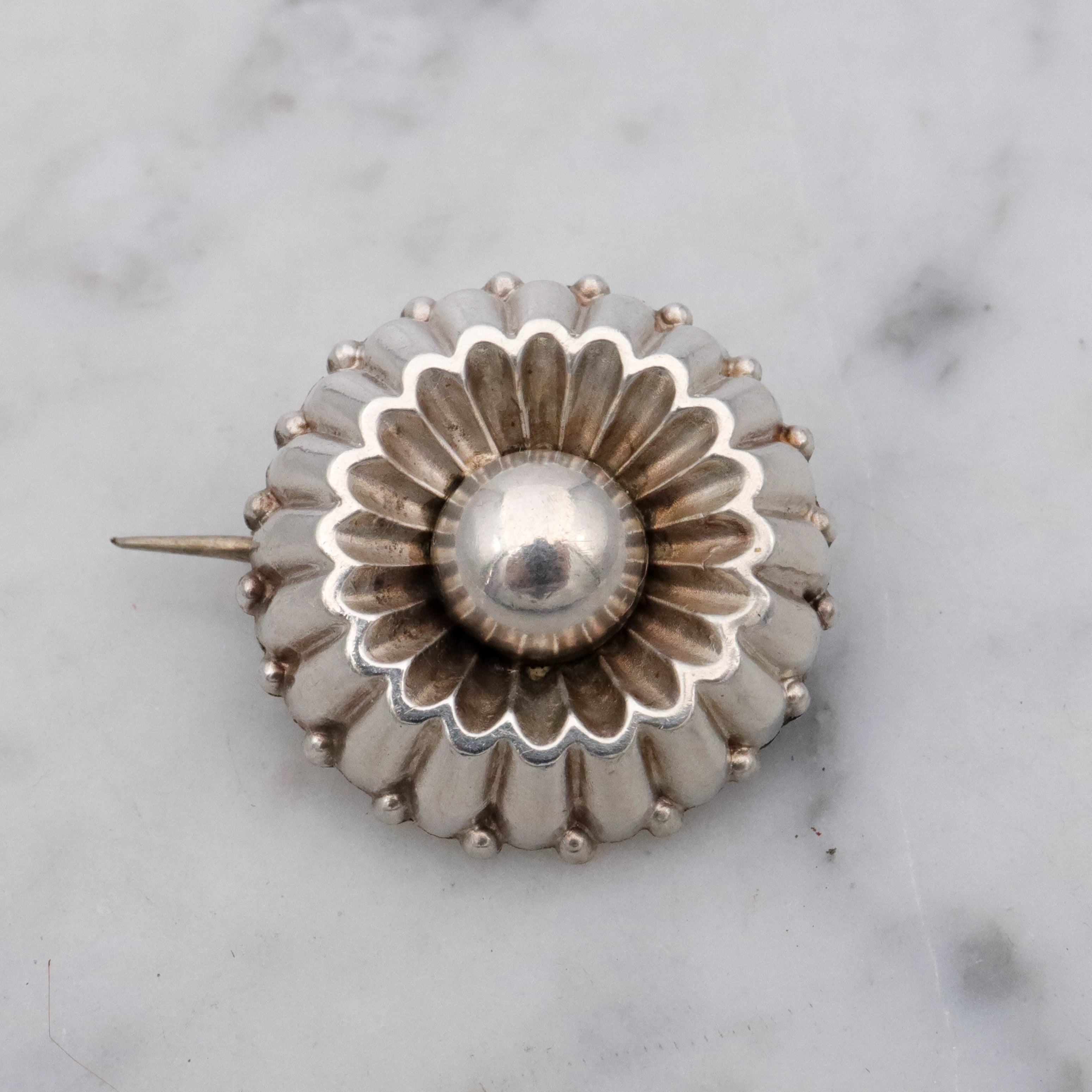 Antique sterling flower button brooch