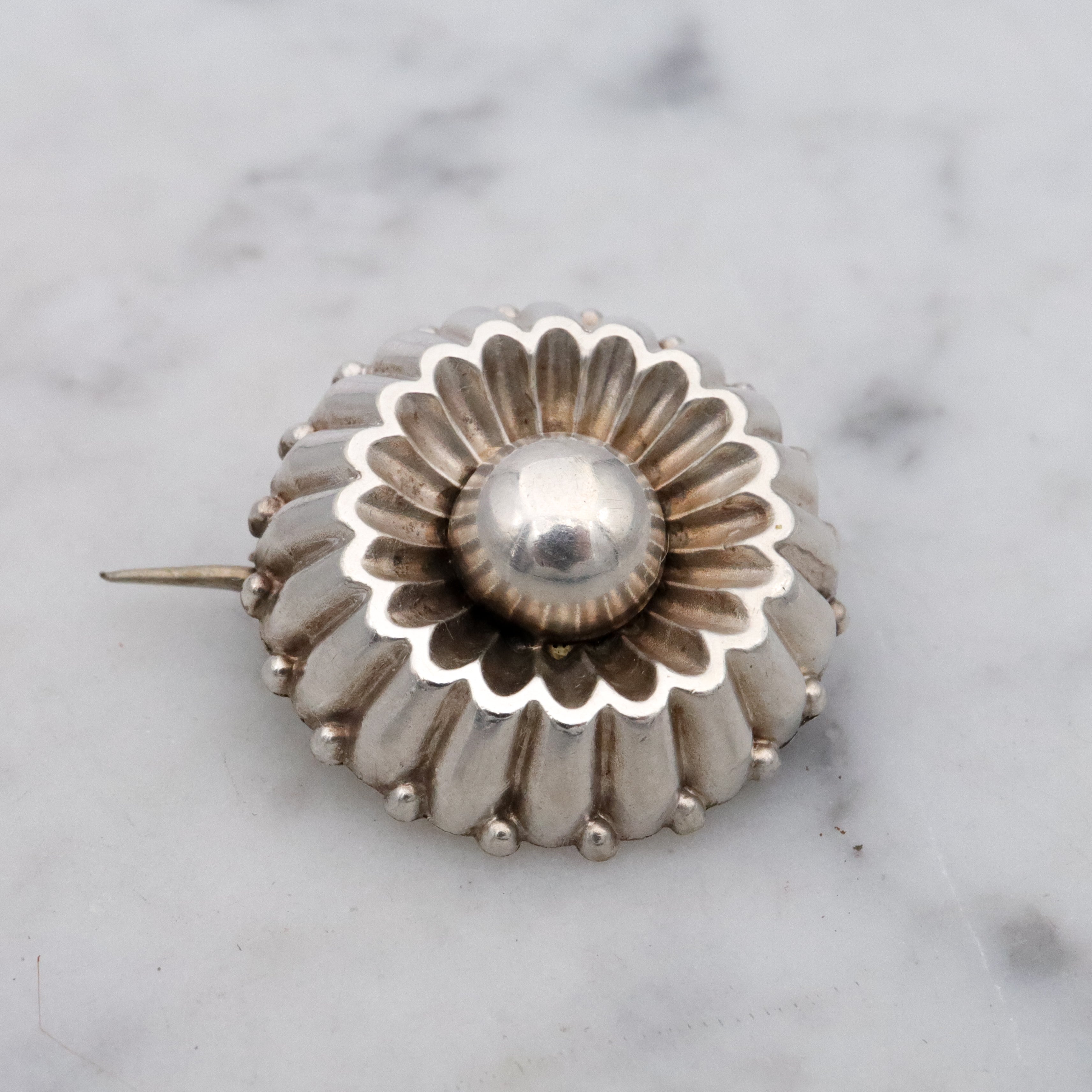 Antique sterling flower button brooch