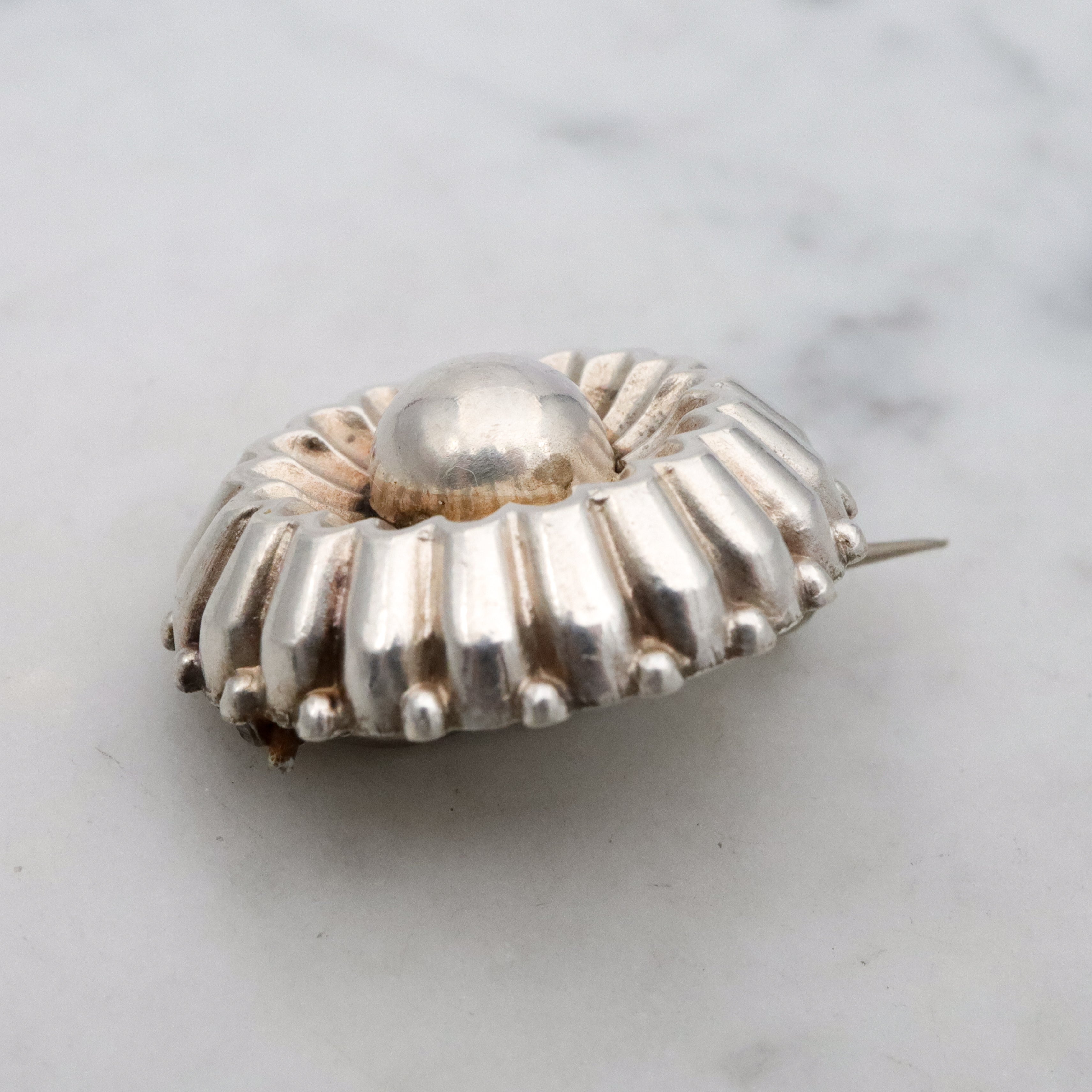 Antique sterling flower button brooch