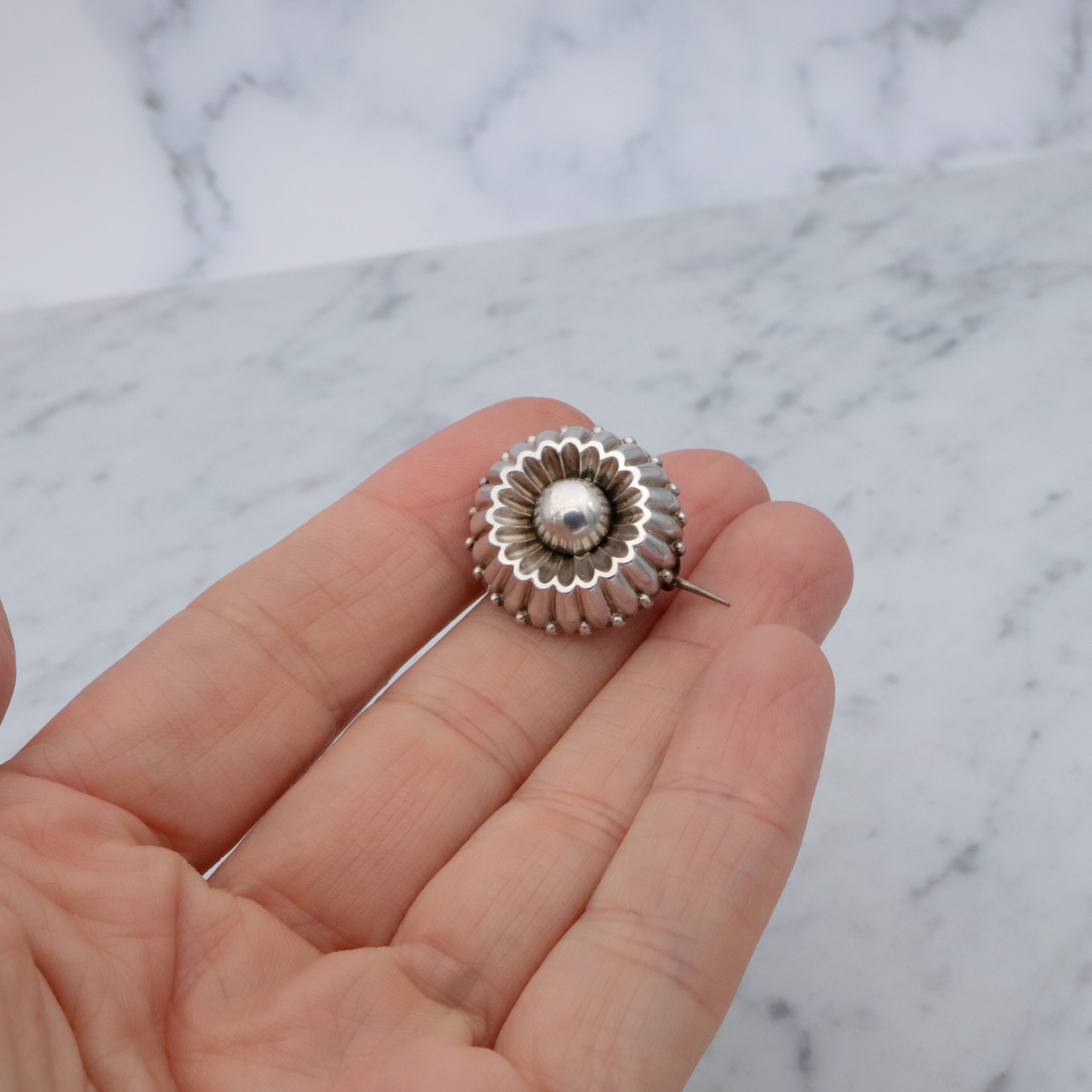 Antique sterling flower button brooch