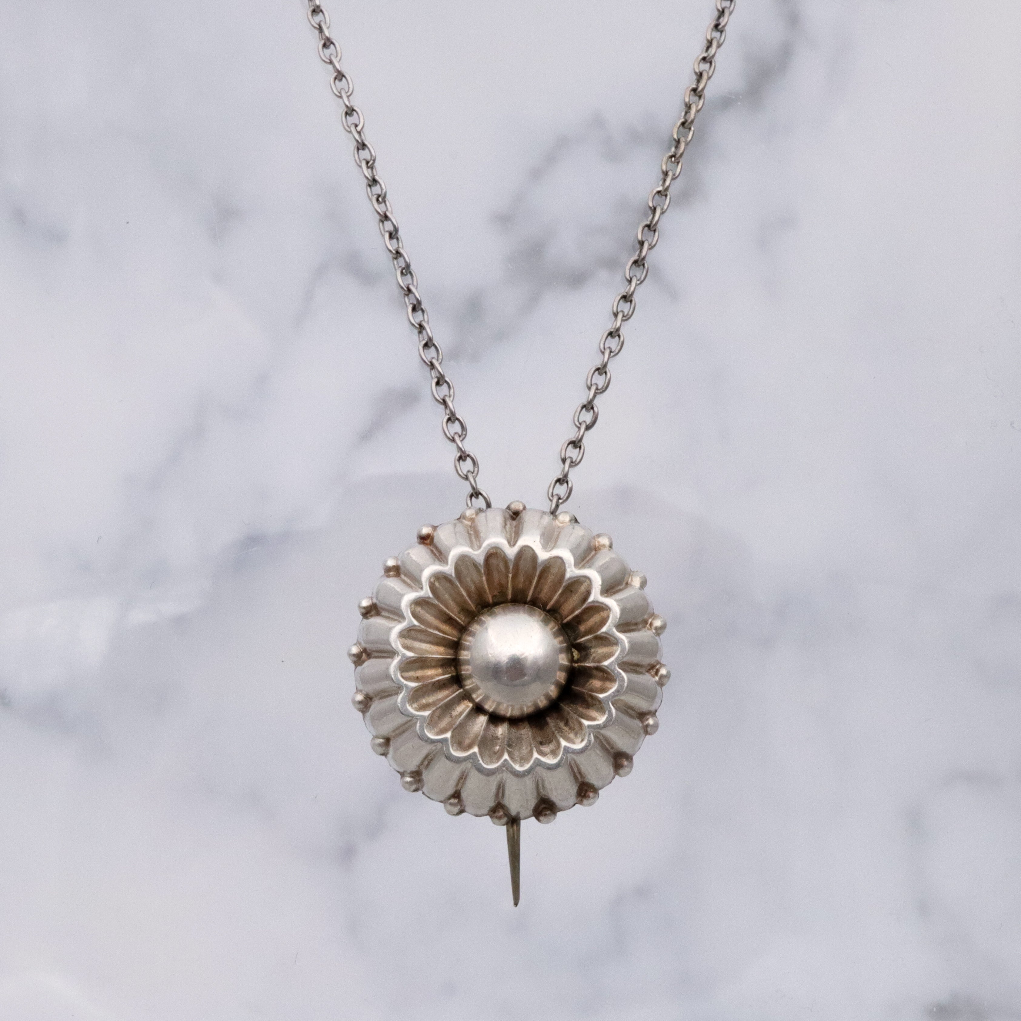 Antique sterling flower button brooch