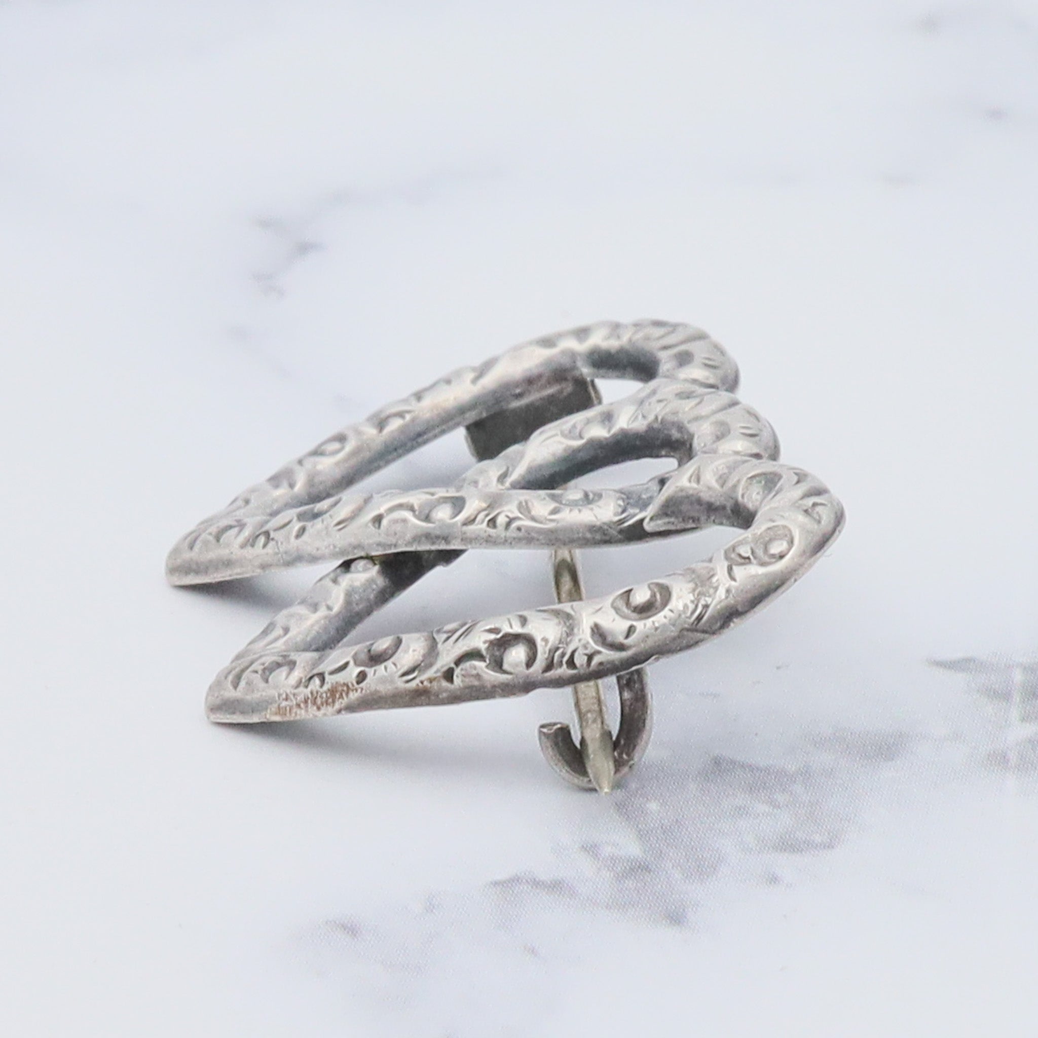 Antique Victorian sterling repousse double heart brooch