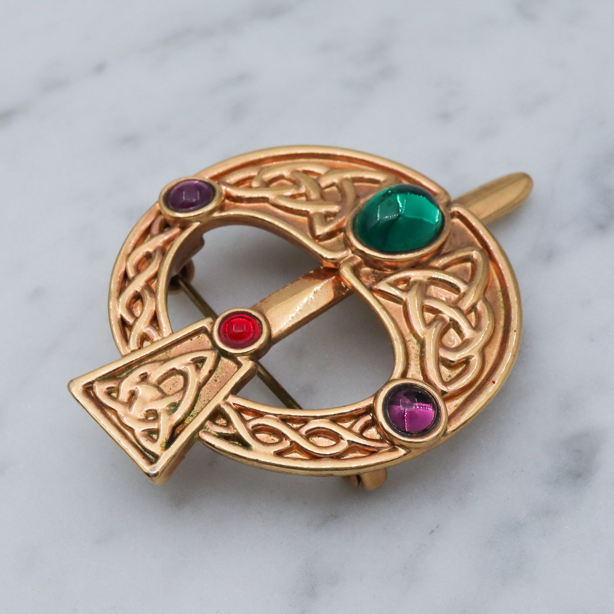 Vintage gold plated Celtic penannular brooch with glass gems