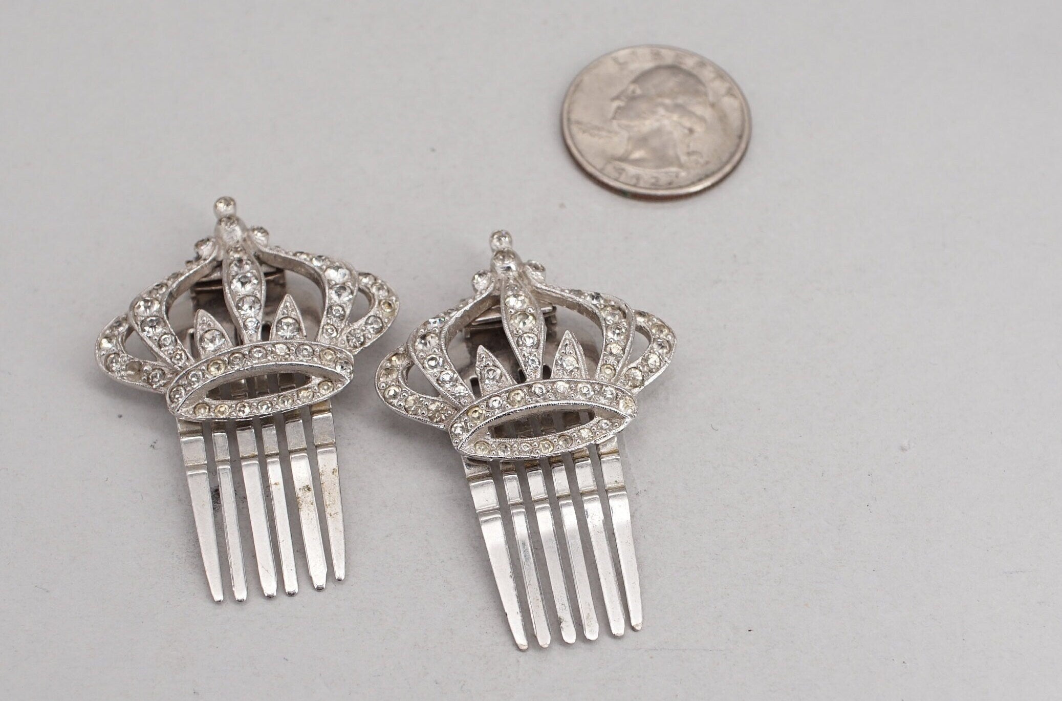 pair of coro silver tone rhinestone crown hair comb clips