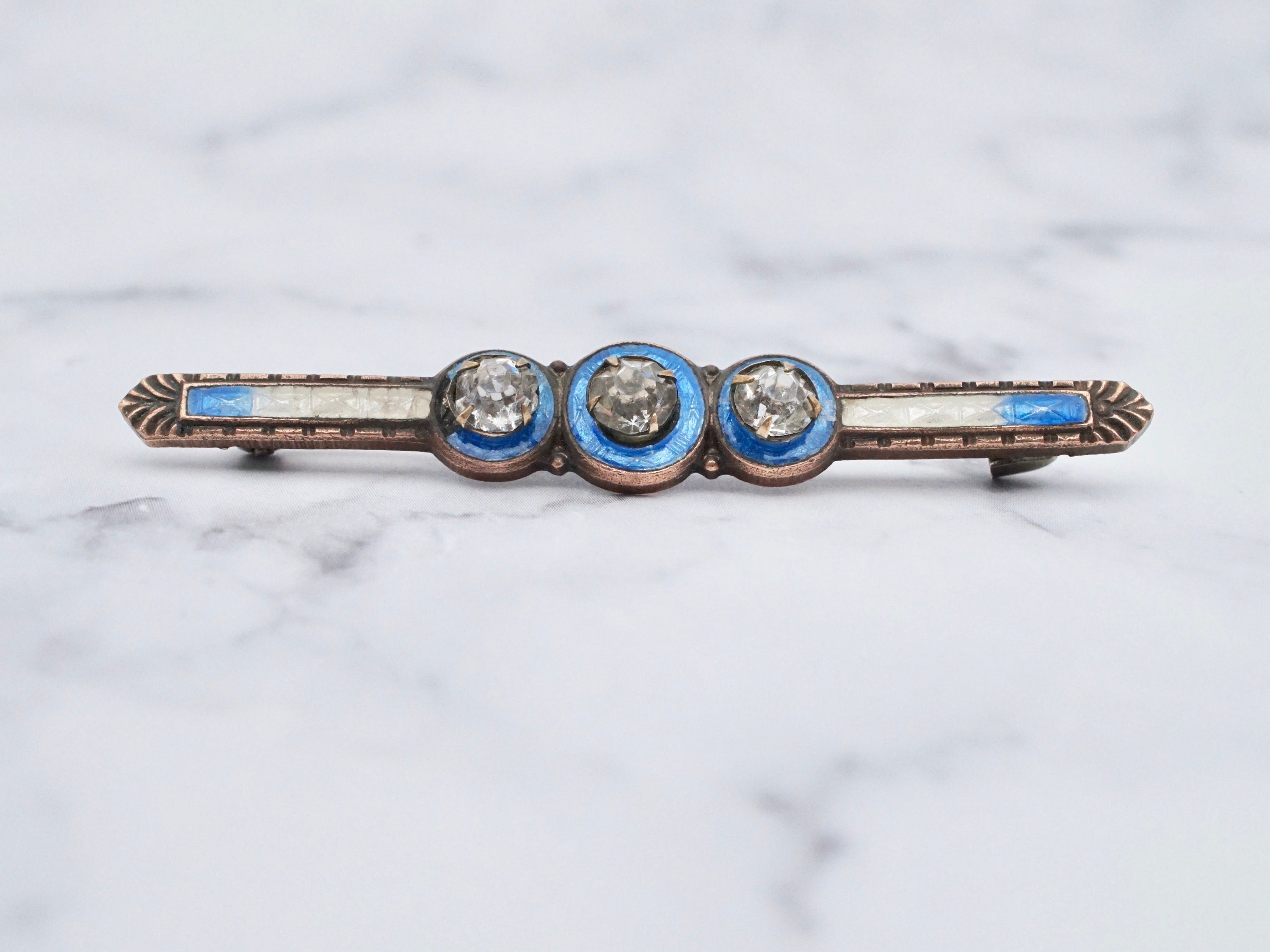 Antique brass enamel rhinestone brooch