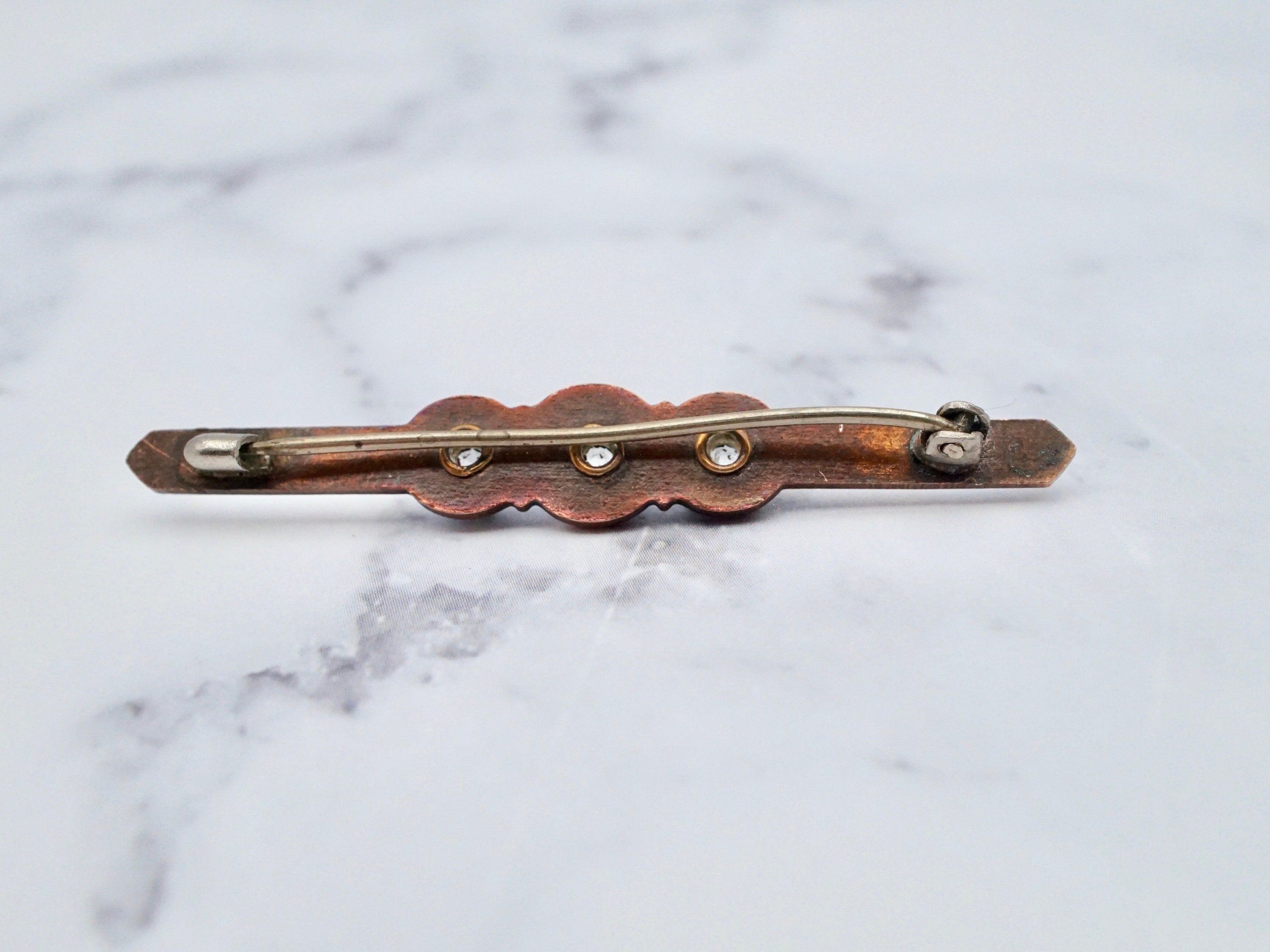 Antique brass enamel rhinestone brooch
