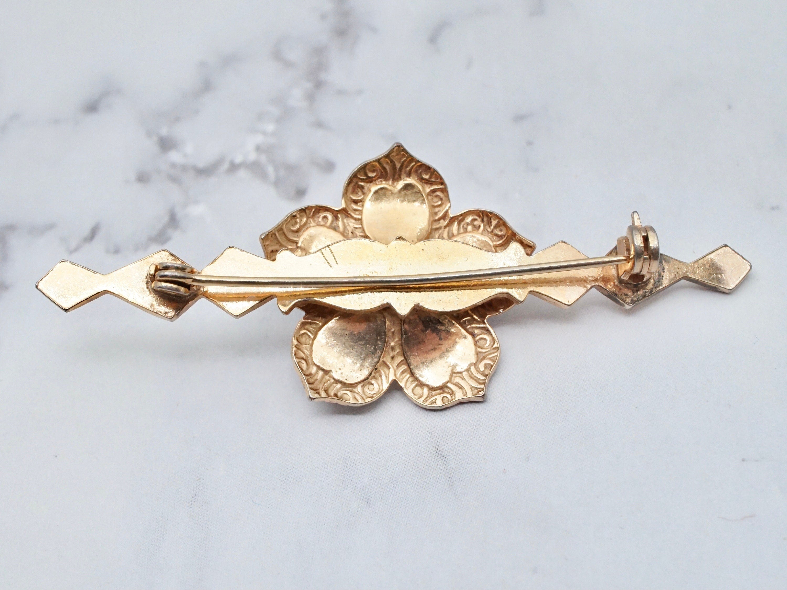 Vintage gold tone, enamel, rhinestone, and faux pearl flower brooch