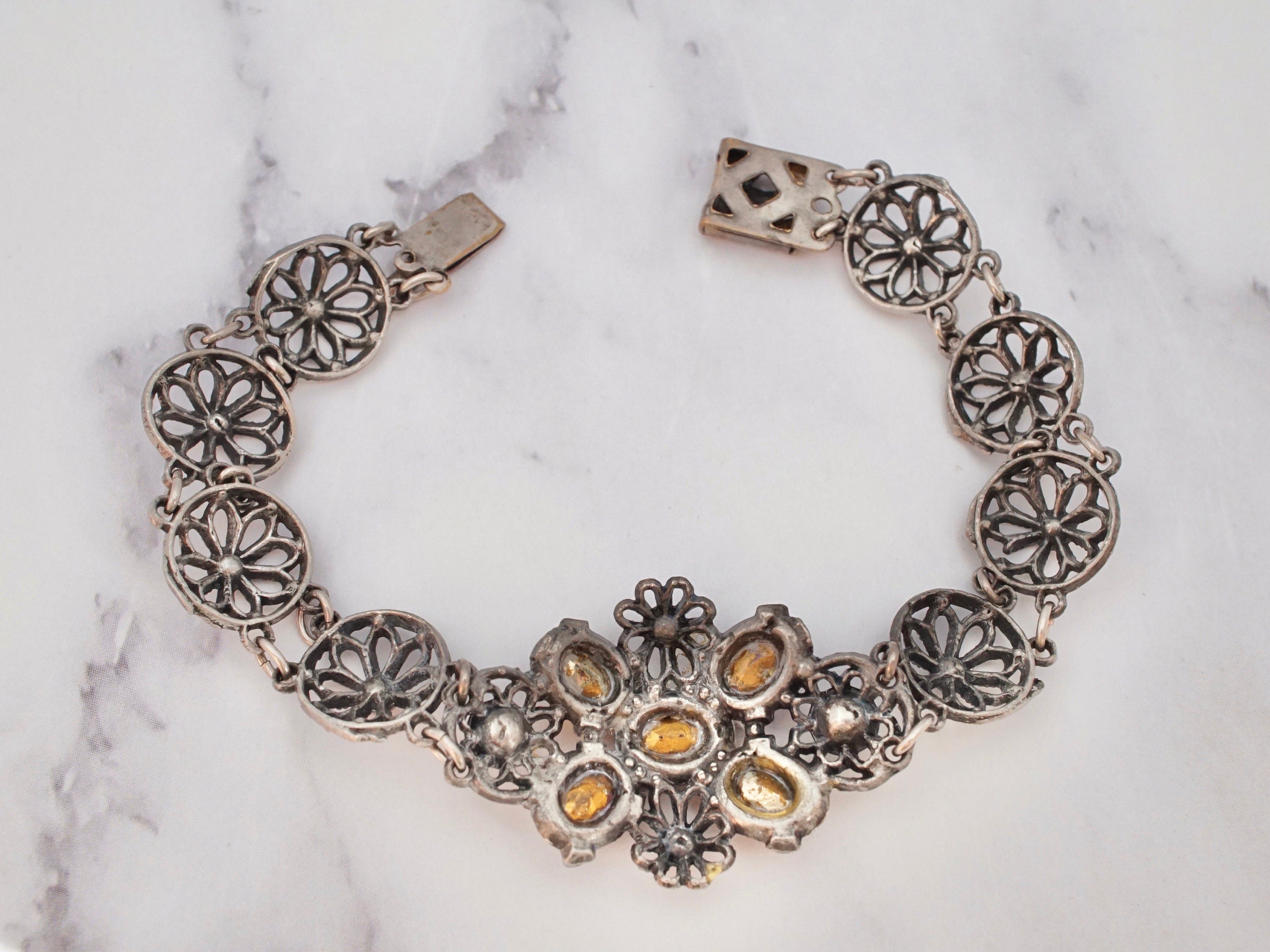 Antique harlequin Czech glass and metal filigree bracelet