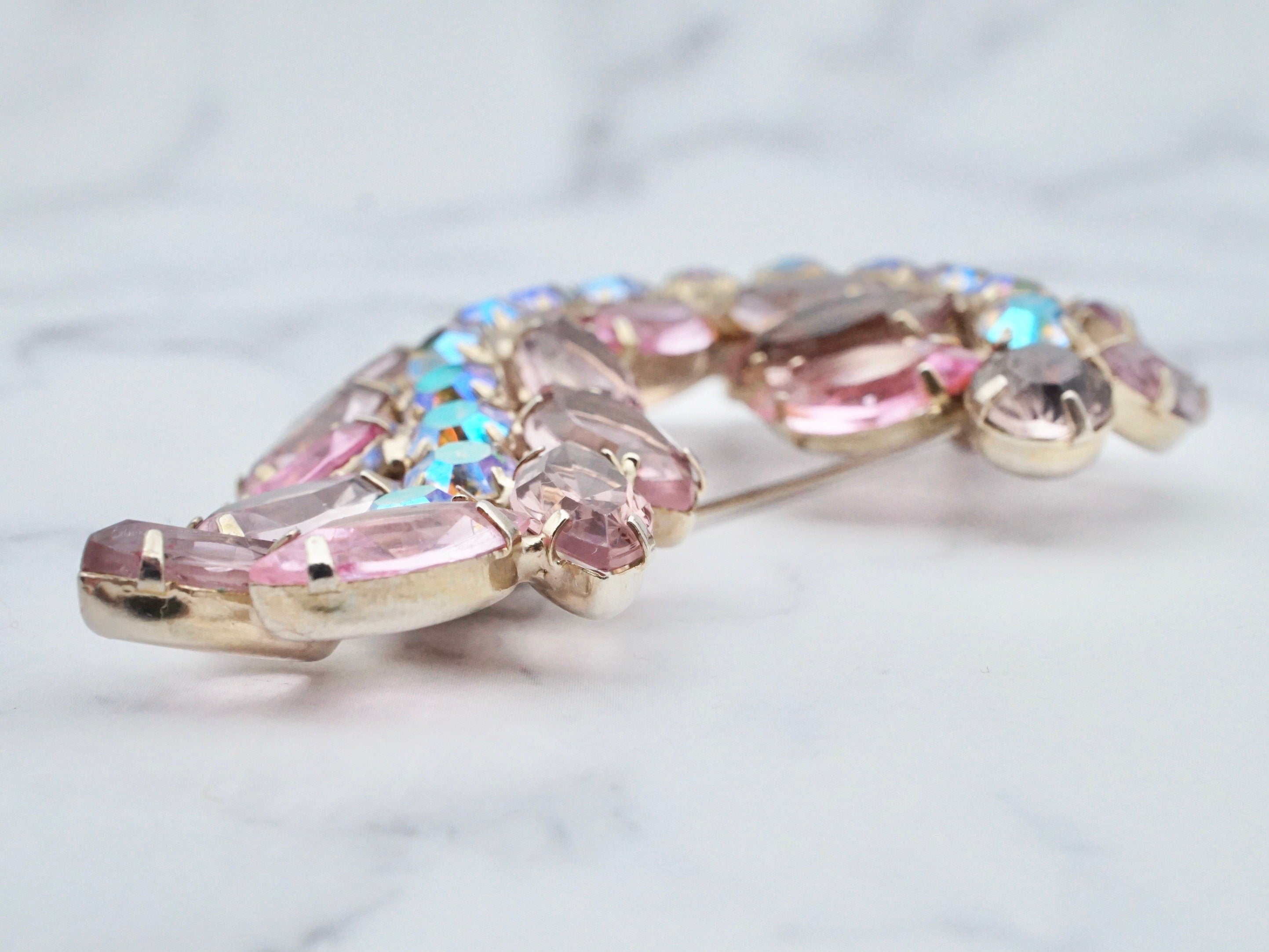 Vintage large lavender & aurora borealis rhinestone open-back swirl leaf brooch