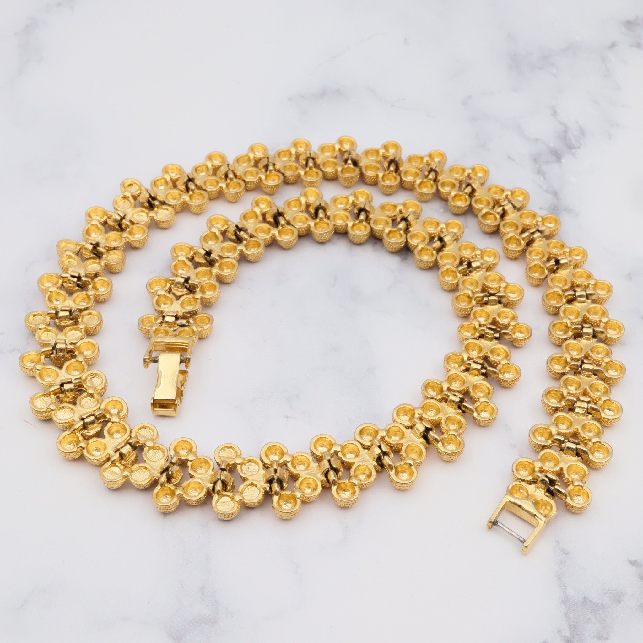 Vintage gold plated textured attached bead necklace with black glass tips