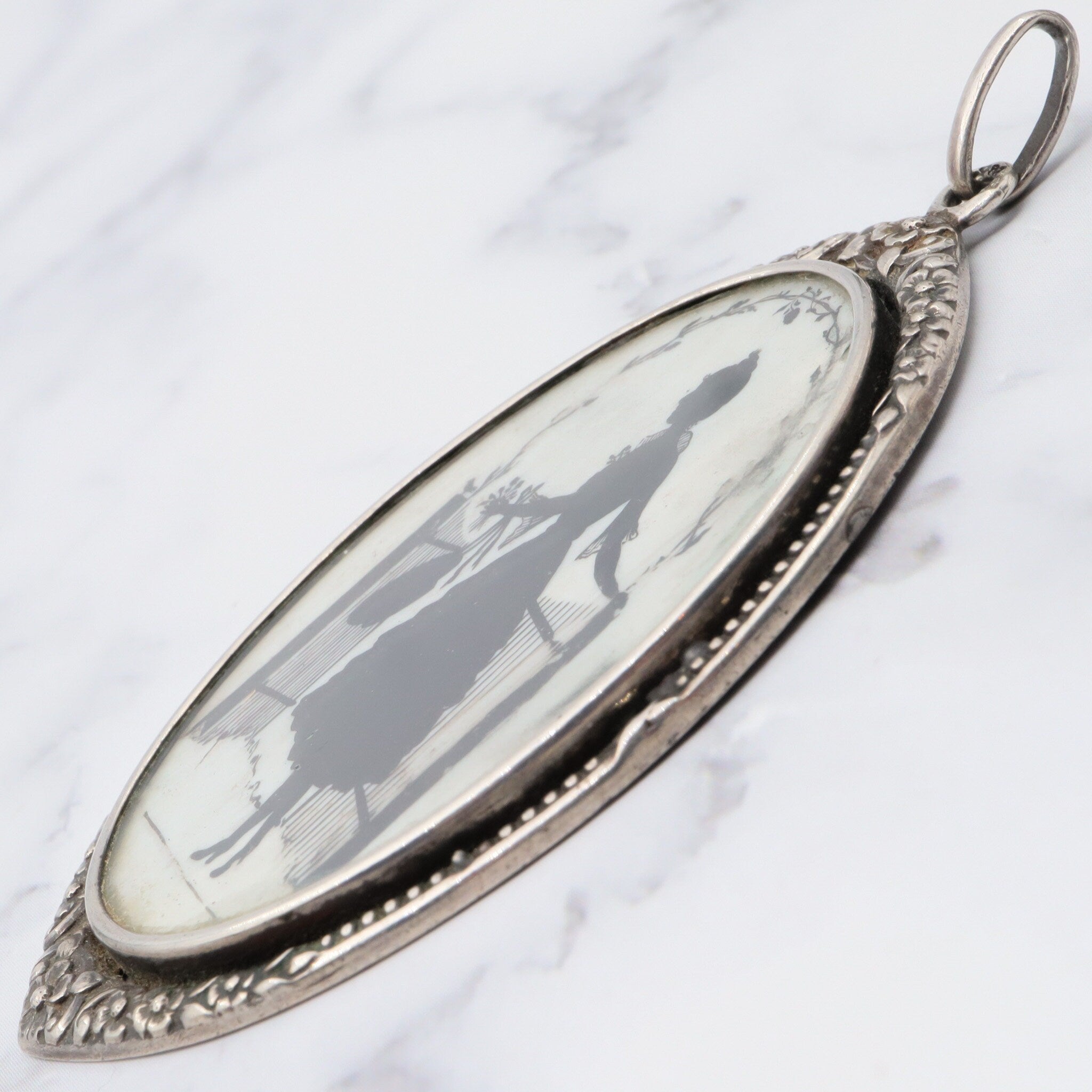 Antique sterling hand painted silhouette portrait pendant