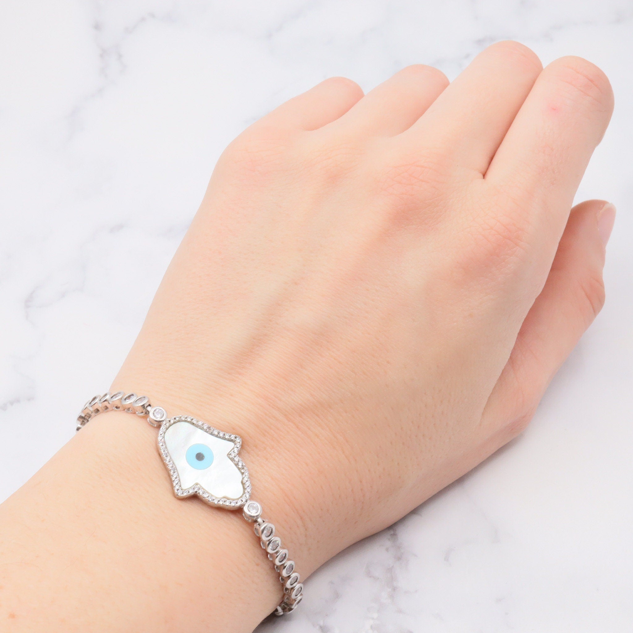 Vintage sterling, mother of pearl, hand of fatima and evil eye bracelet with cubic zirconia links