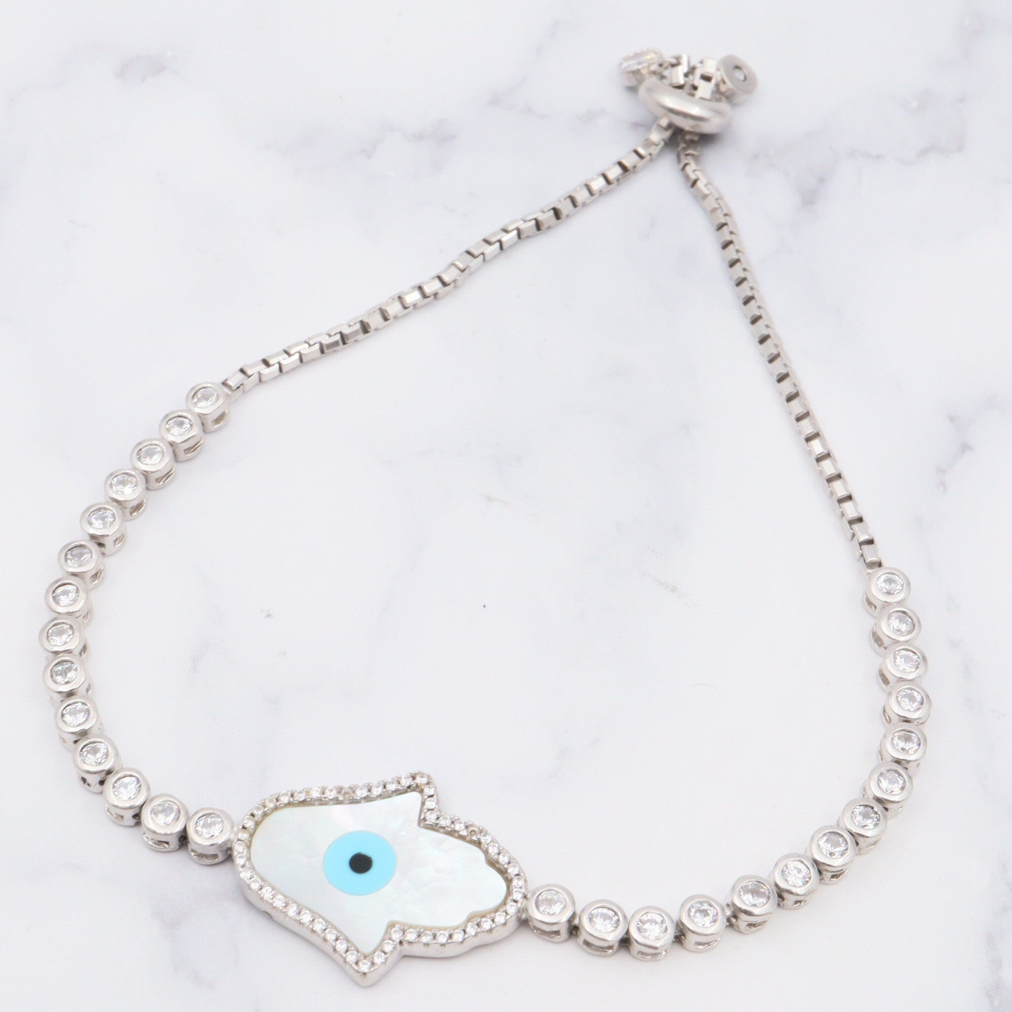 Vintage sterling, mother of pearl, hand of fatima and evil eye bracelet with cubic zirconia links