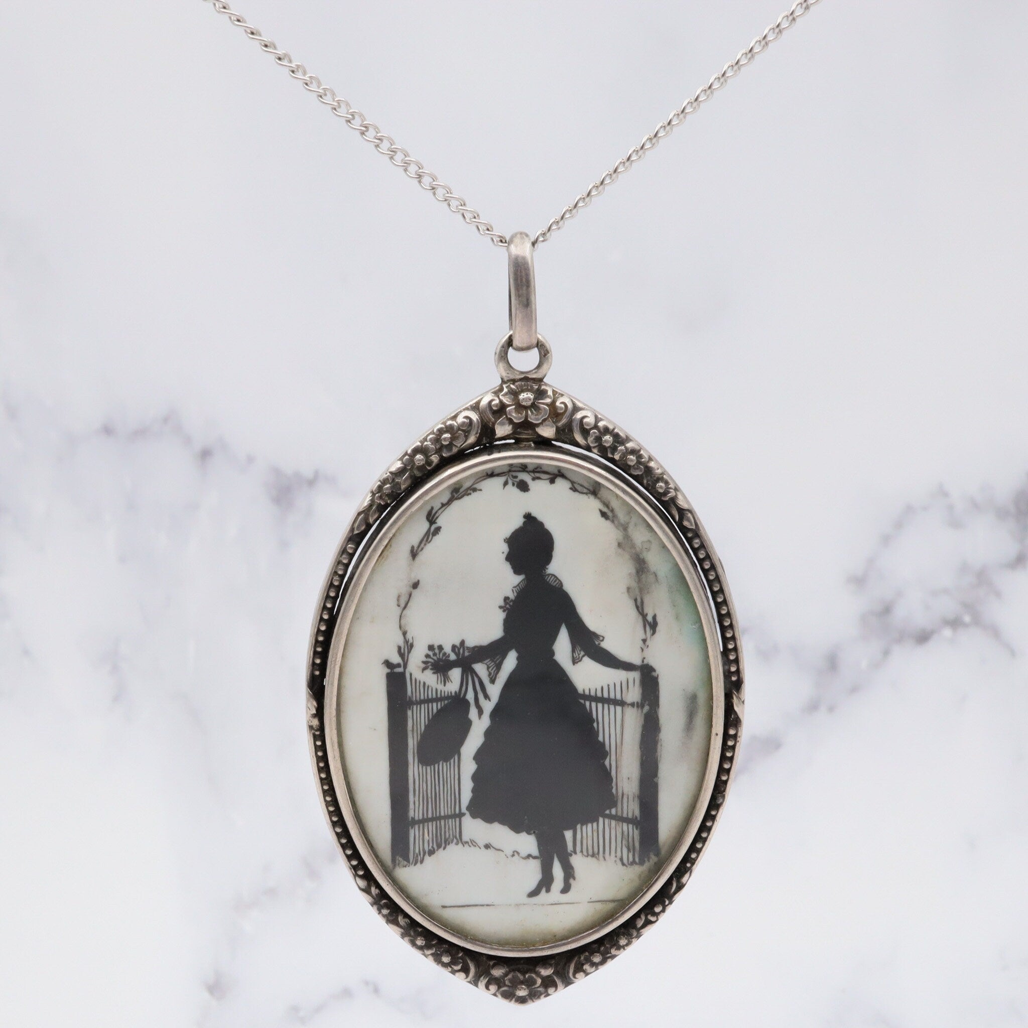 Antique sterling hand painted silhouette portrait pendant