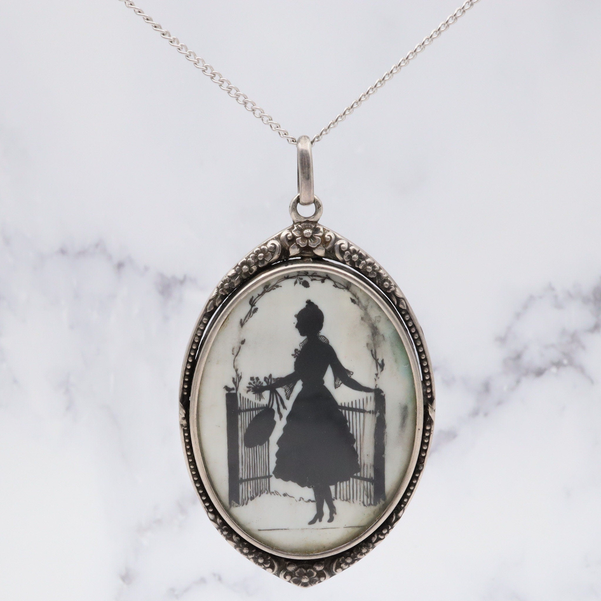 Antique sterling hand painted silhouette portrait pendant