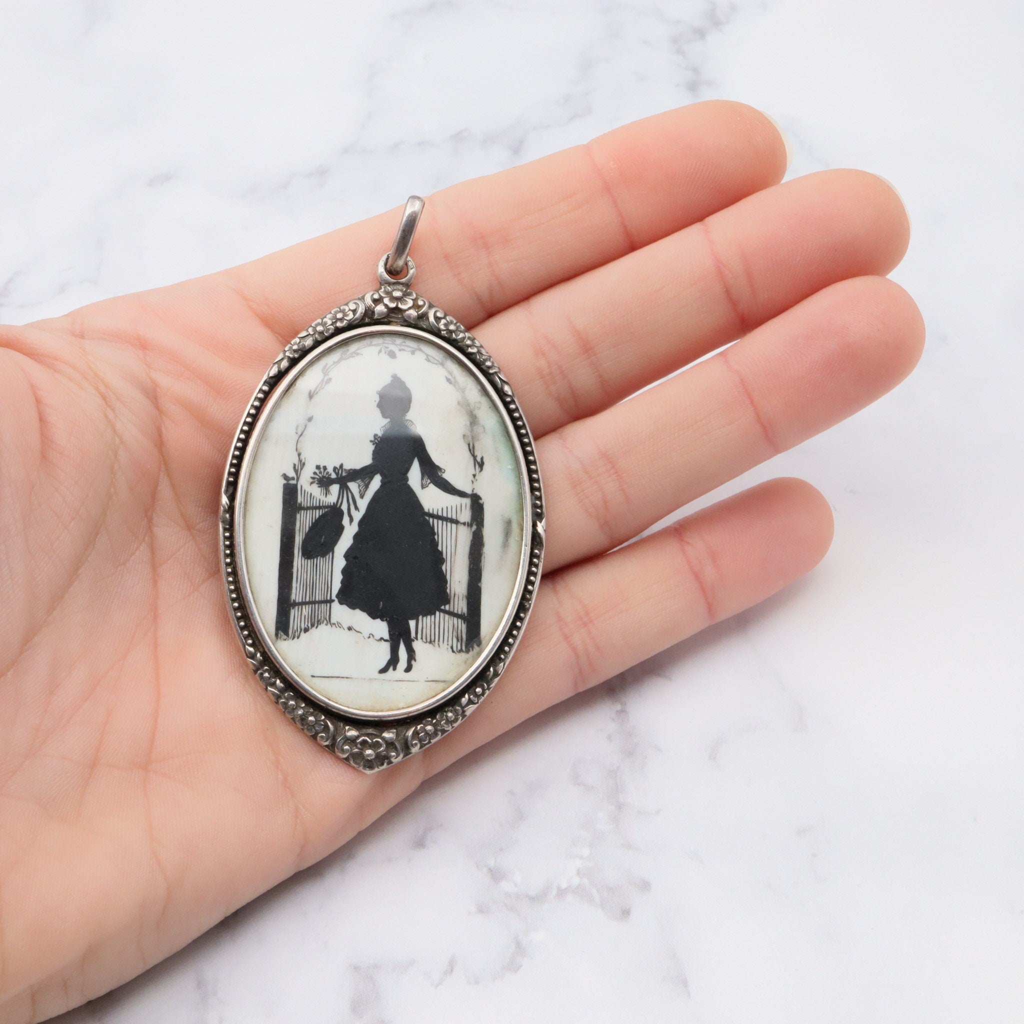 Antique sterling hand painted silhouette portrait pendant