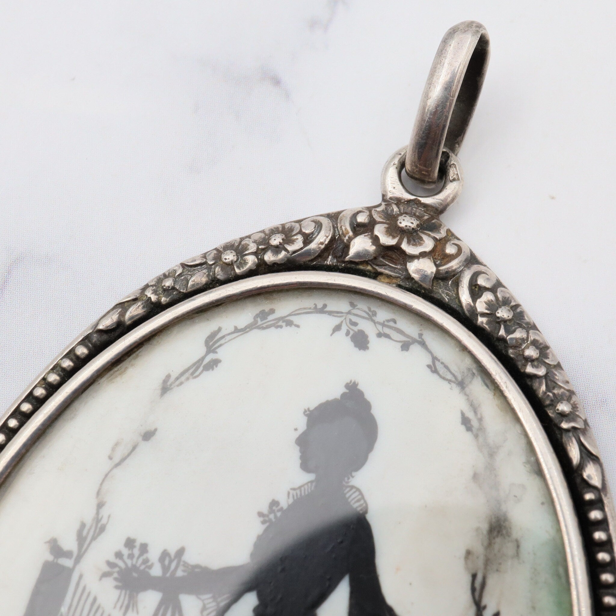 Antique sterling hand painted silhouette portrait pendant