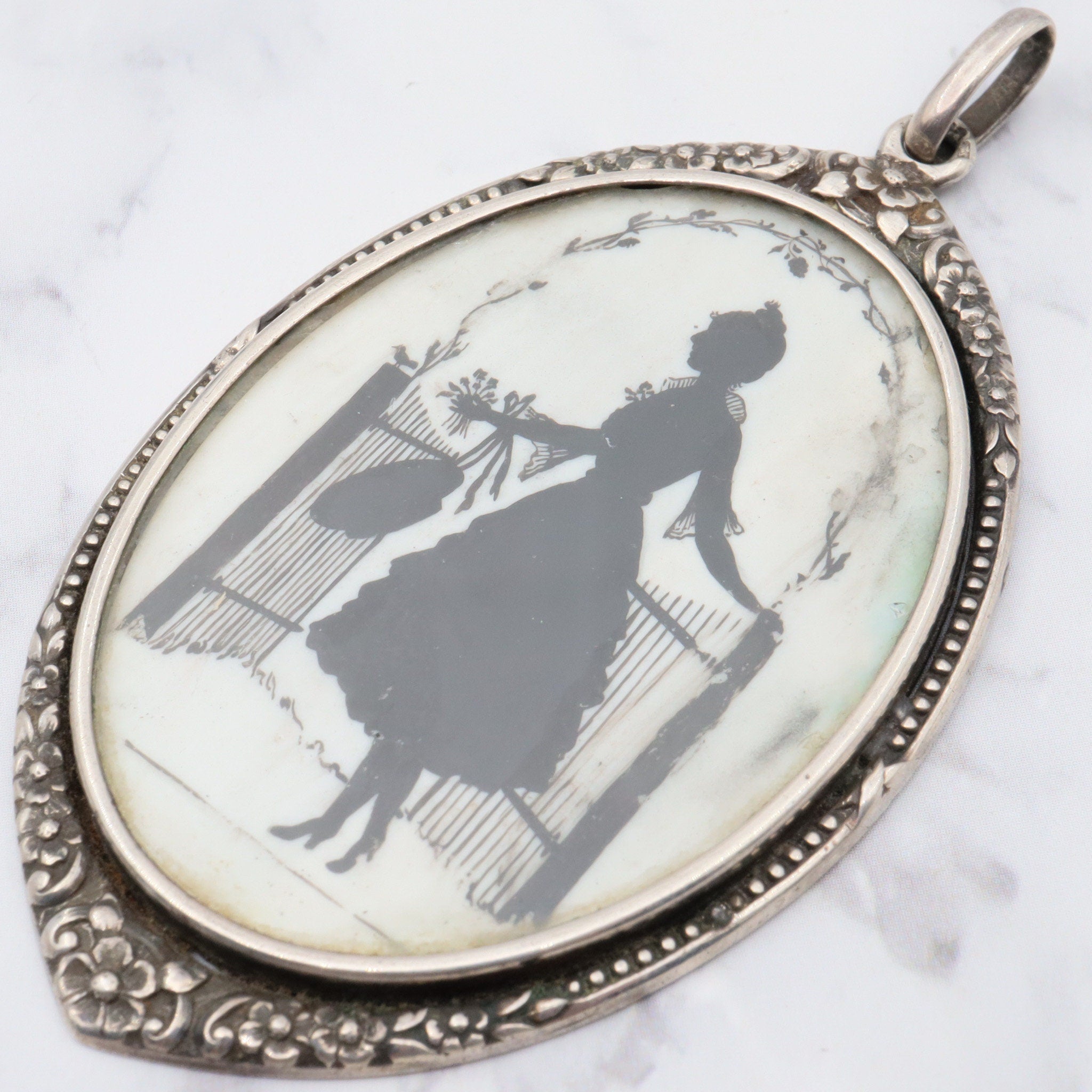 Antique sterling hand painted silhouette portrait pendant