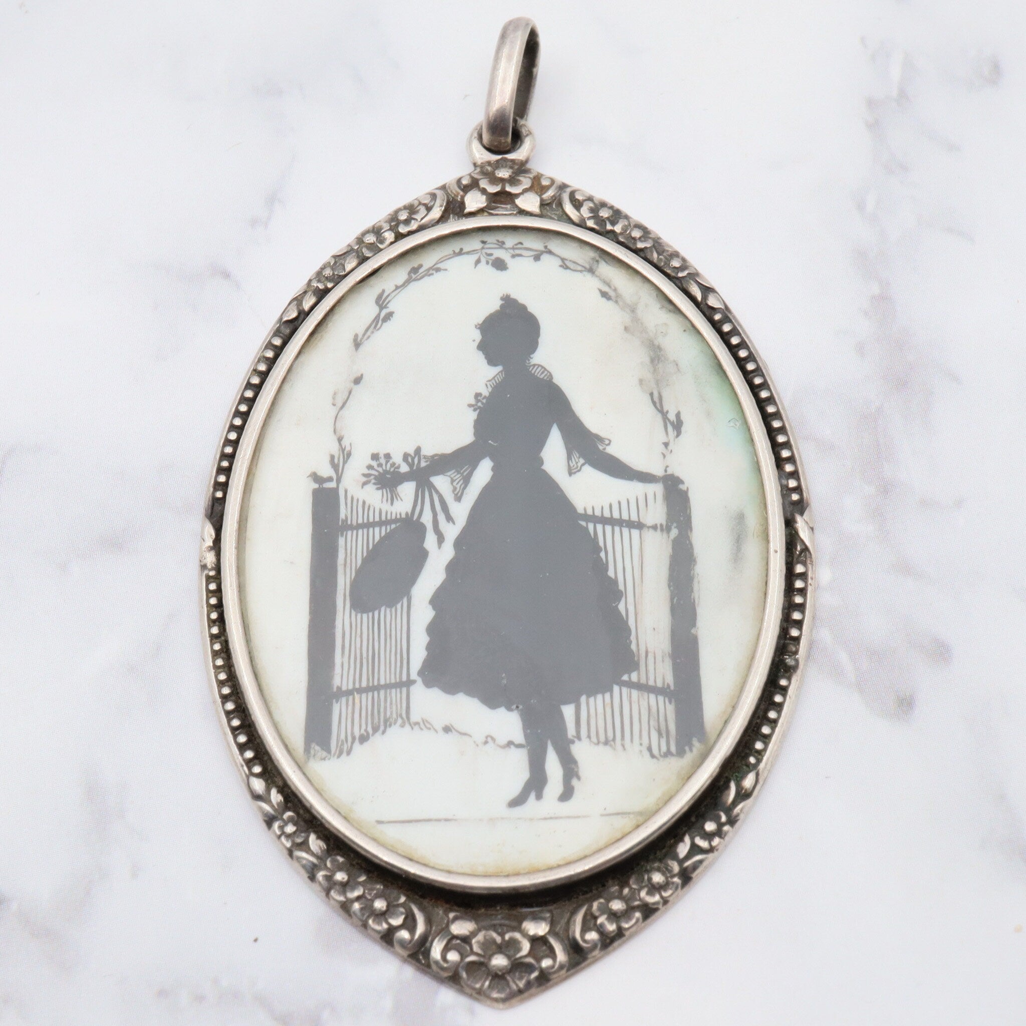 Antique sterling hand painted silhouette portrait pendant