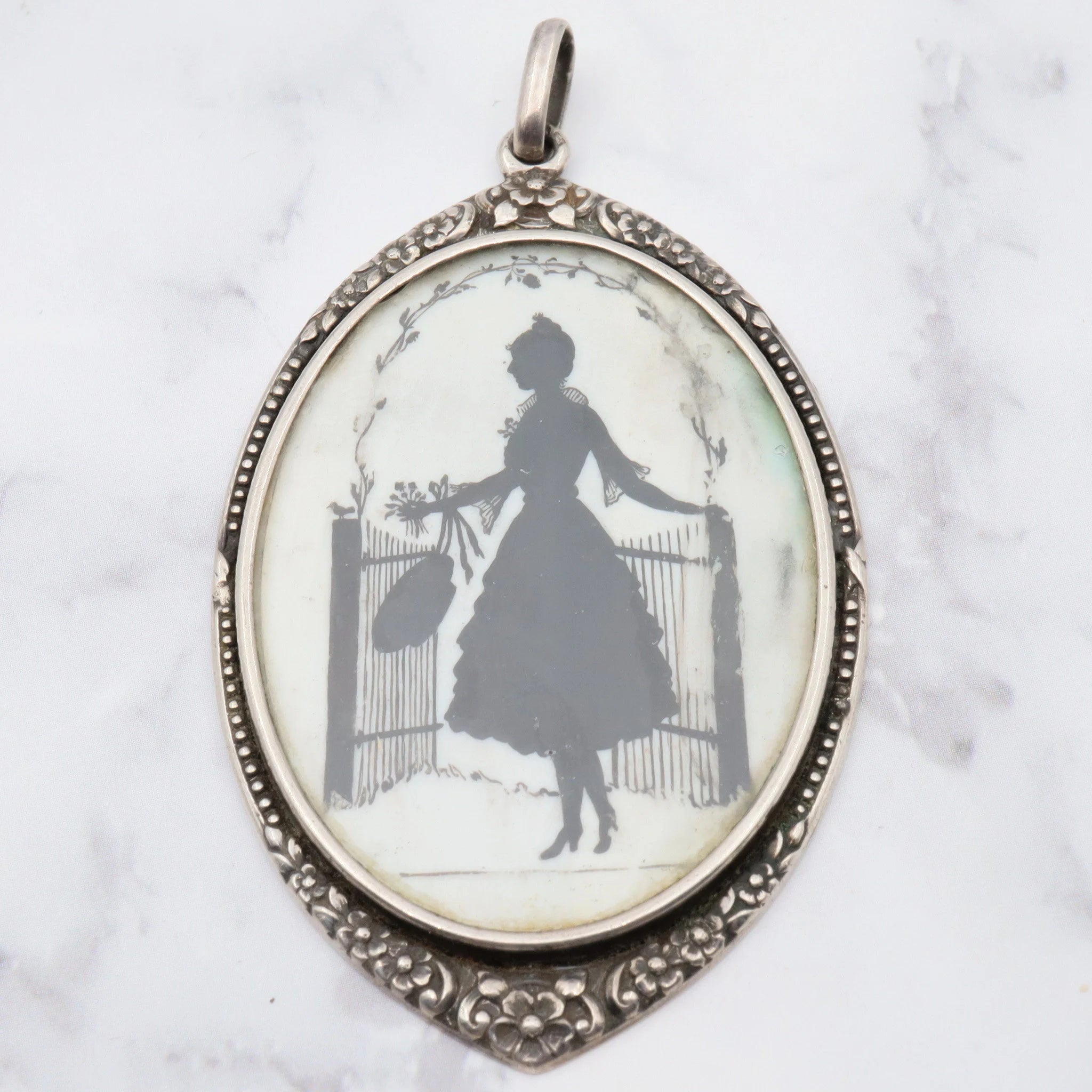 Antique Victorian sterling hand painted silhouette portrait pendant