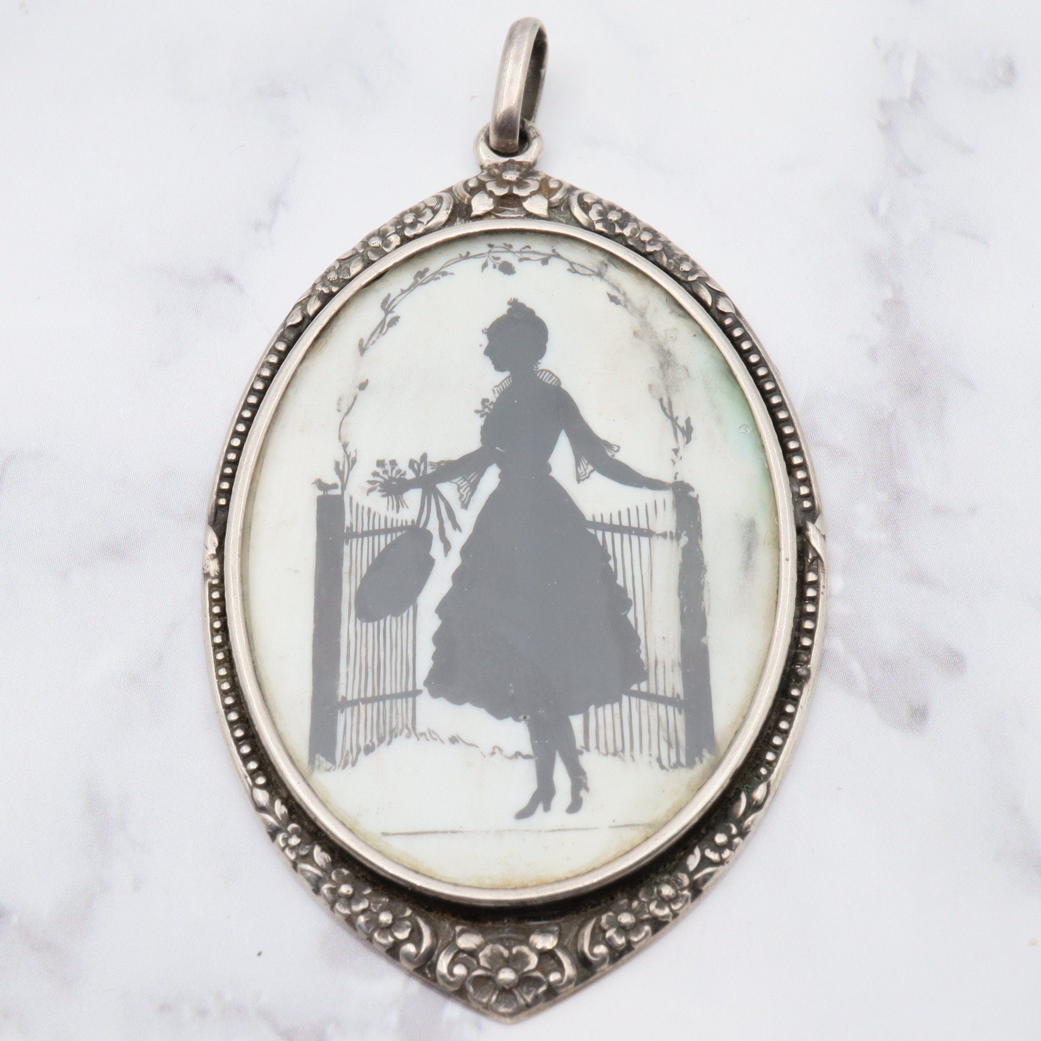 Antique sterling hand painted silhouette portrait pendant