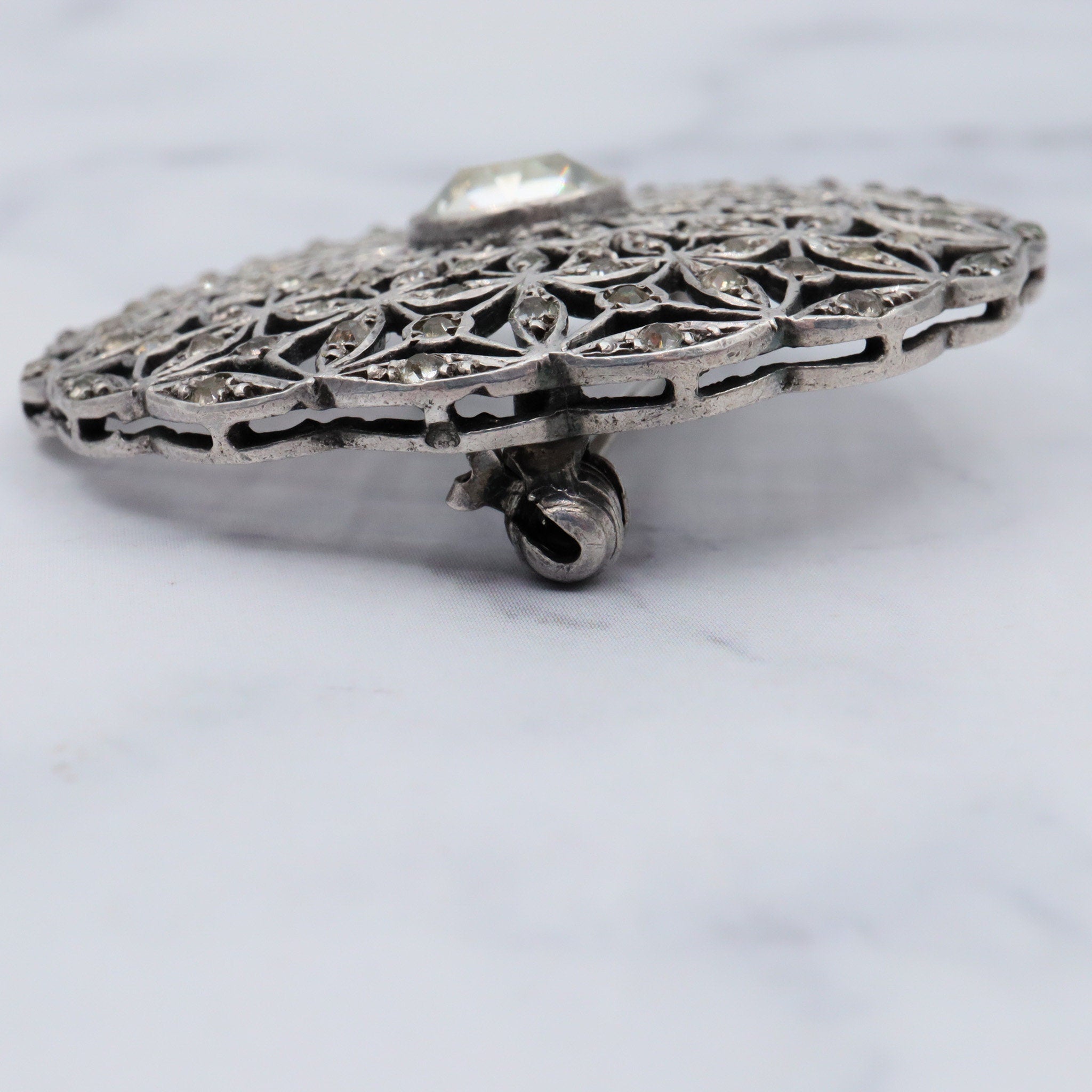 Antique French Art Deco .900 silver & paste filigree circle brooch by Andre Godefroy