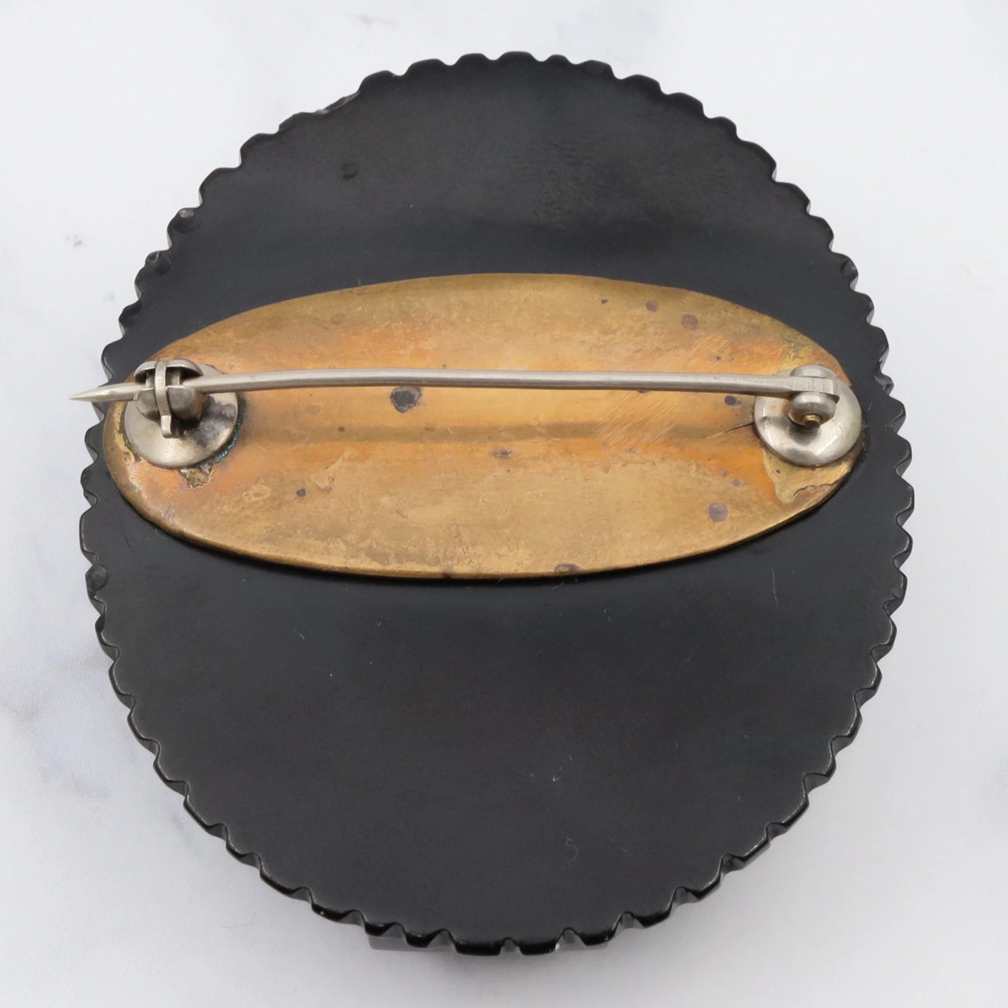 Antique Victorian caved bakelite mourning brooch